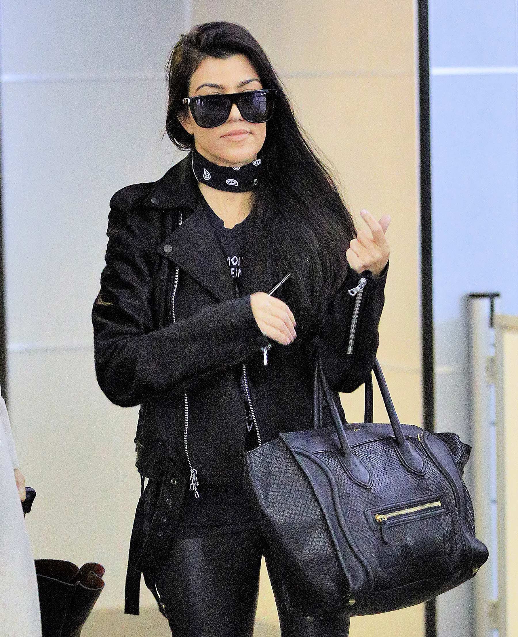 Kourtney Kardashian is seen at LAX and JFK airports