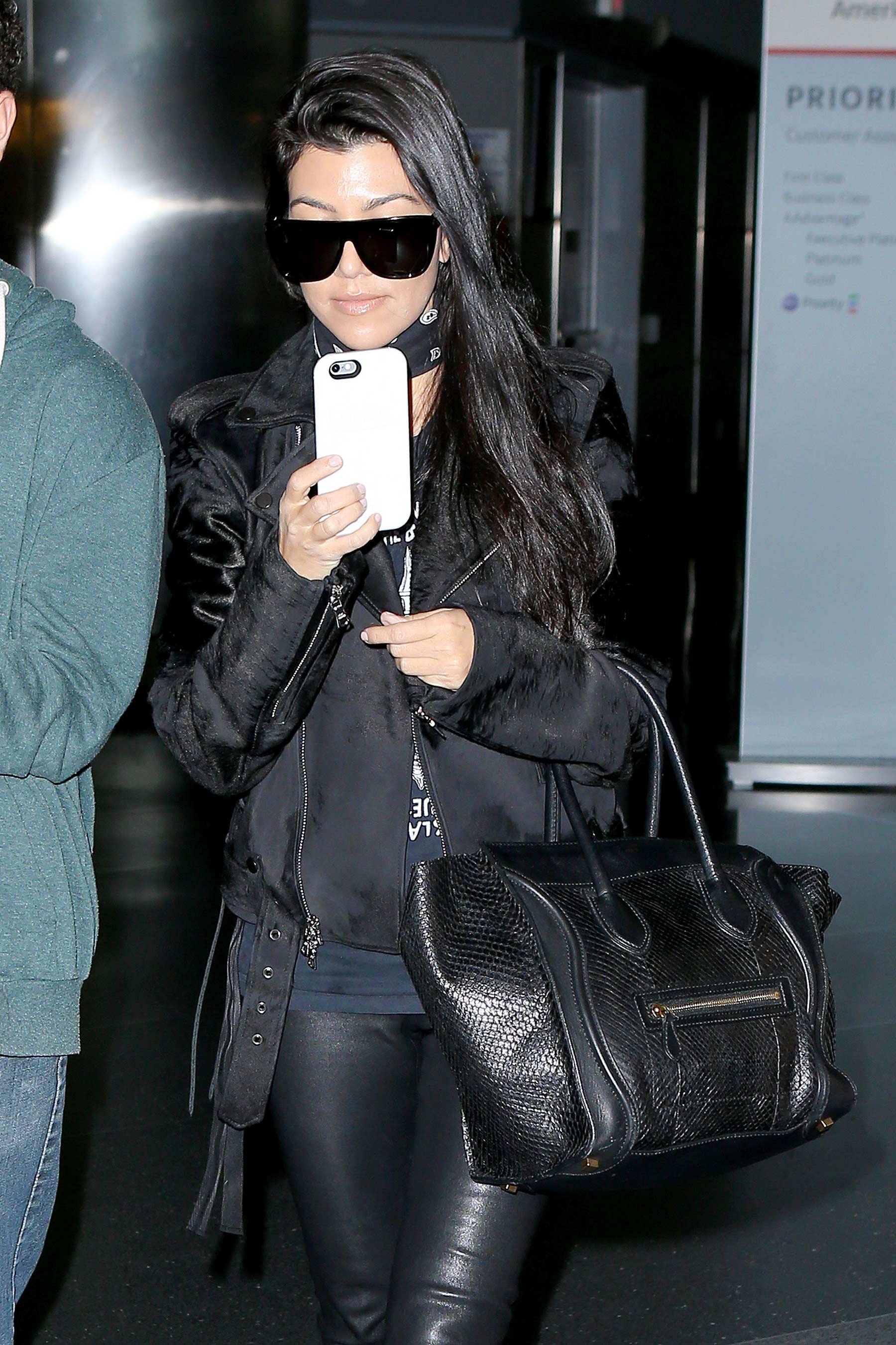 Kourtney Kardashian is seen at LAX and JFK airports