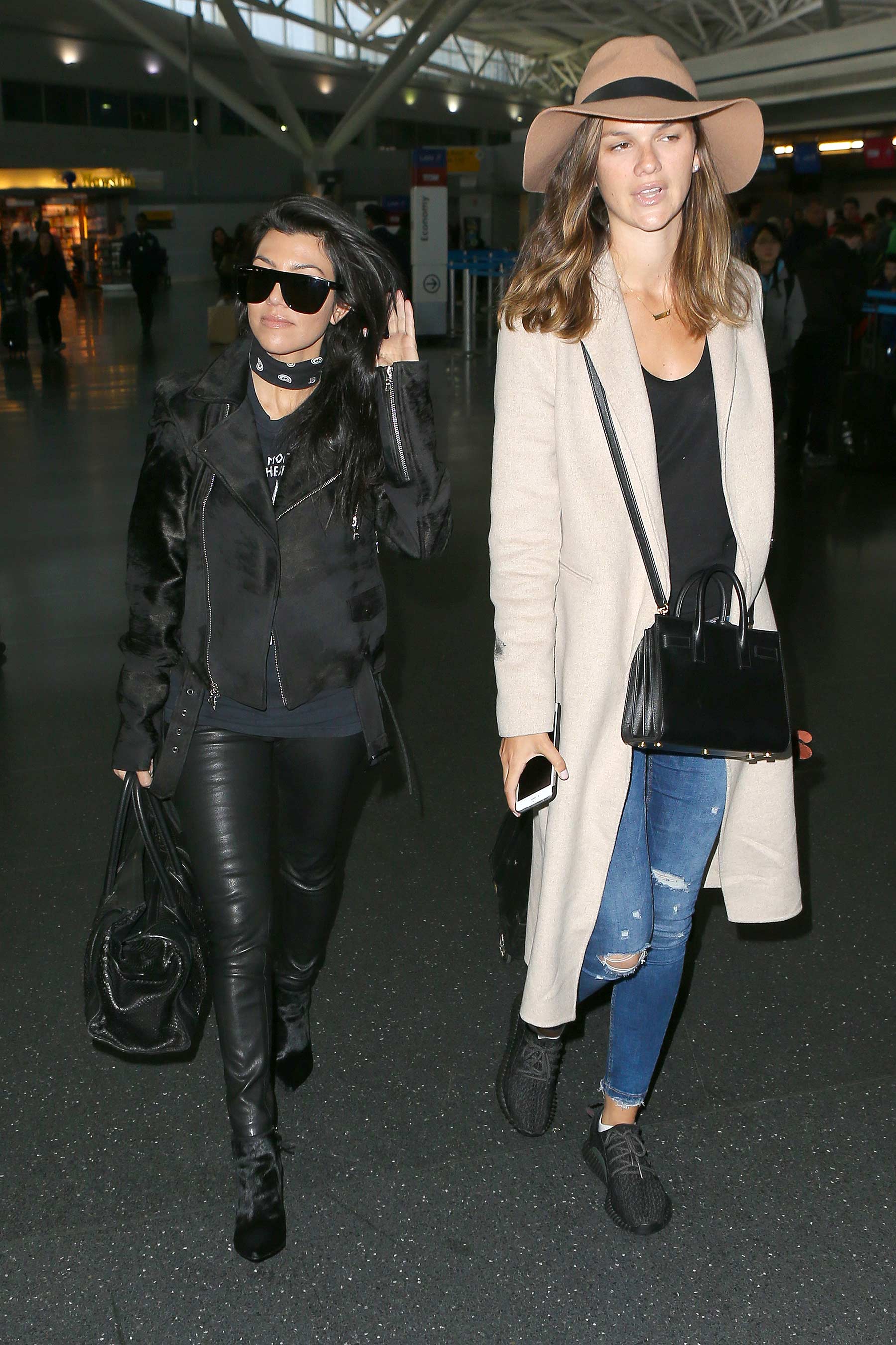 Kourtney Kardashian is seen at LAX and JFK airports