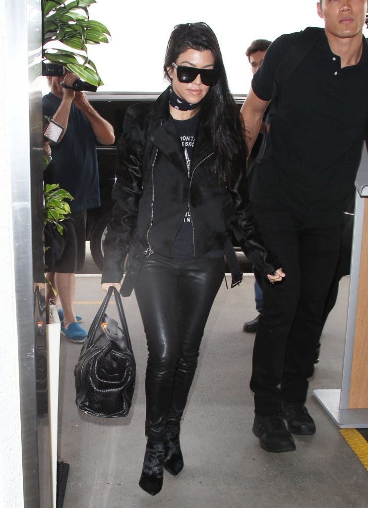 Kourtney Kardashian is seen at LAX and JFK airports