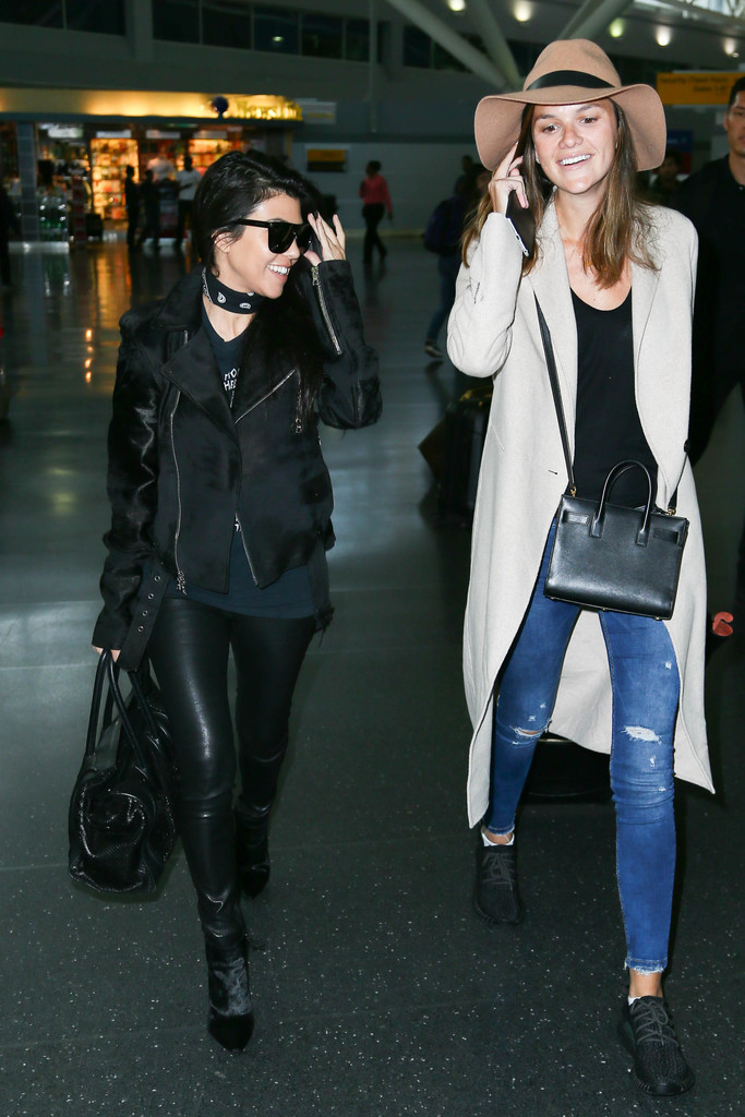 Kourtney Kardashian is seen at LAX and JFK airports