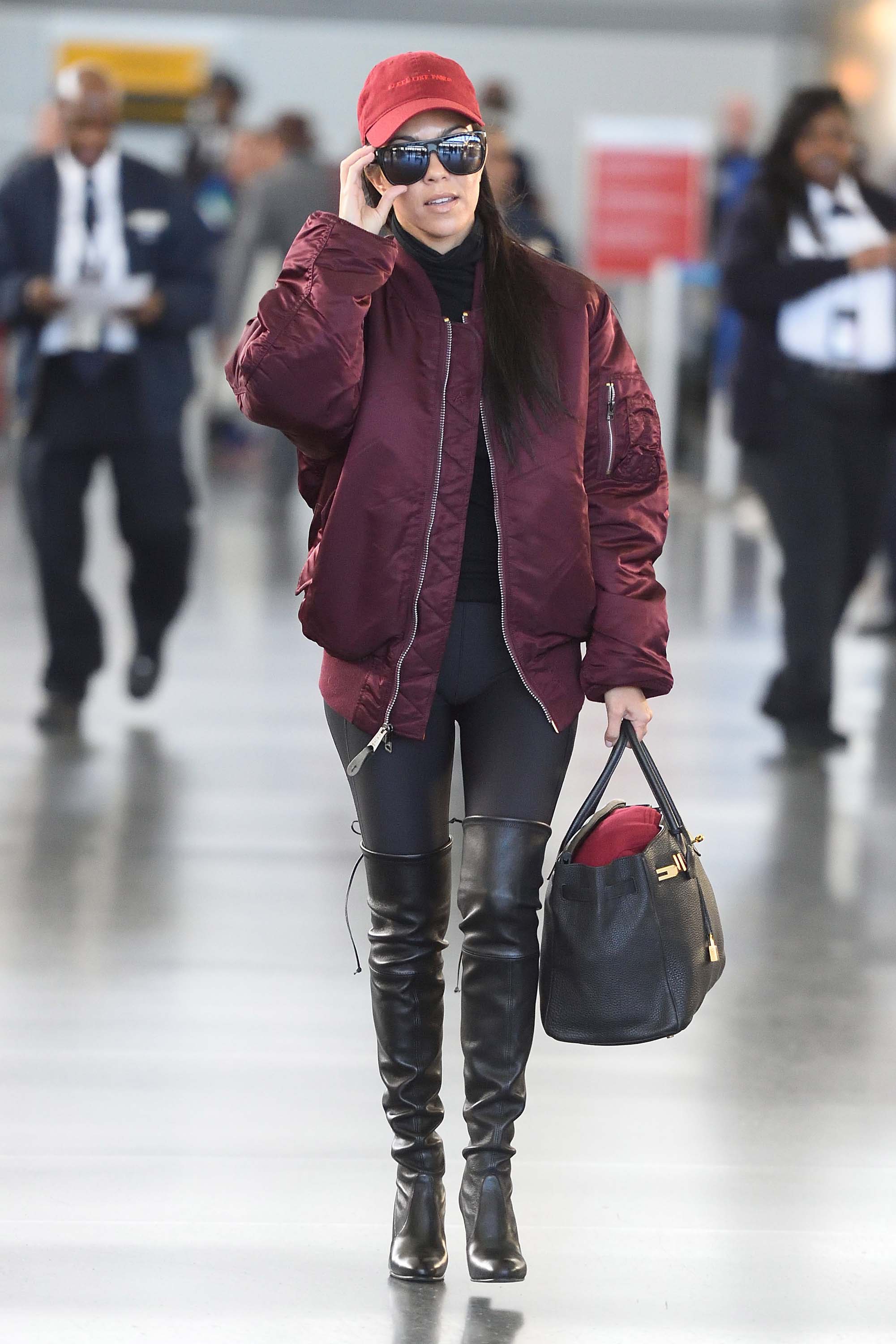 Kourtney Kardashian making her way through JFK airport