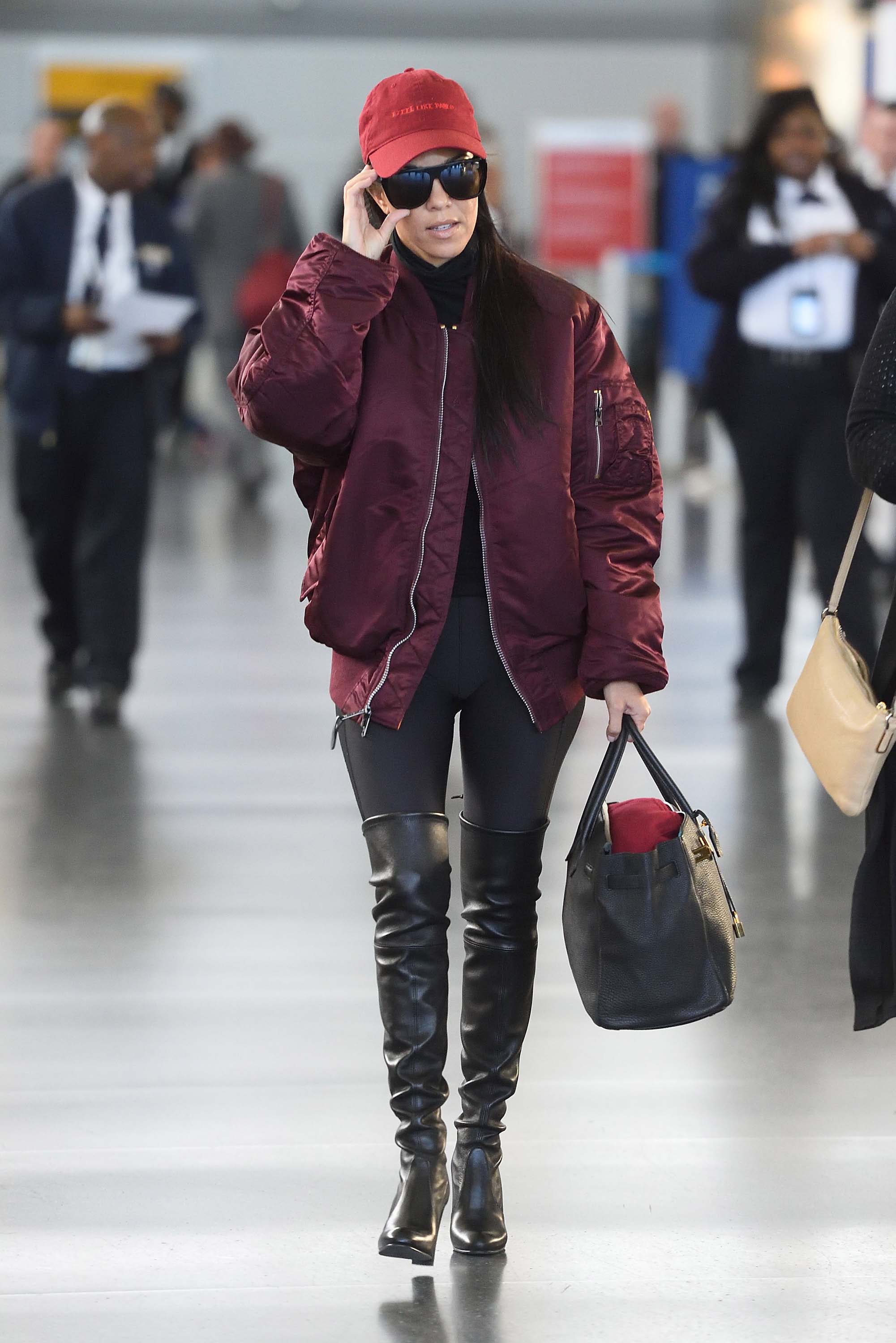 Kourtney Kardashian making her way through JFK airport