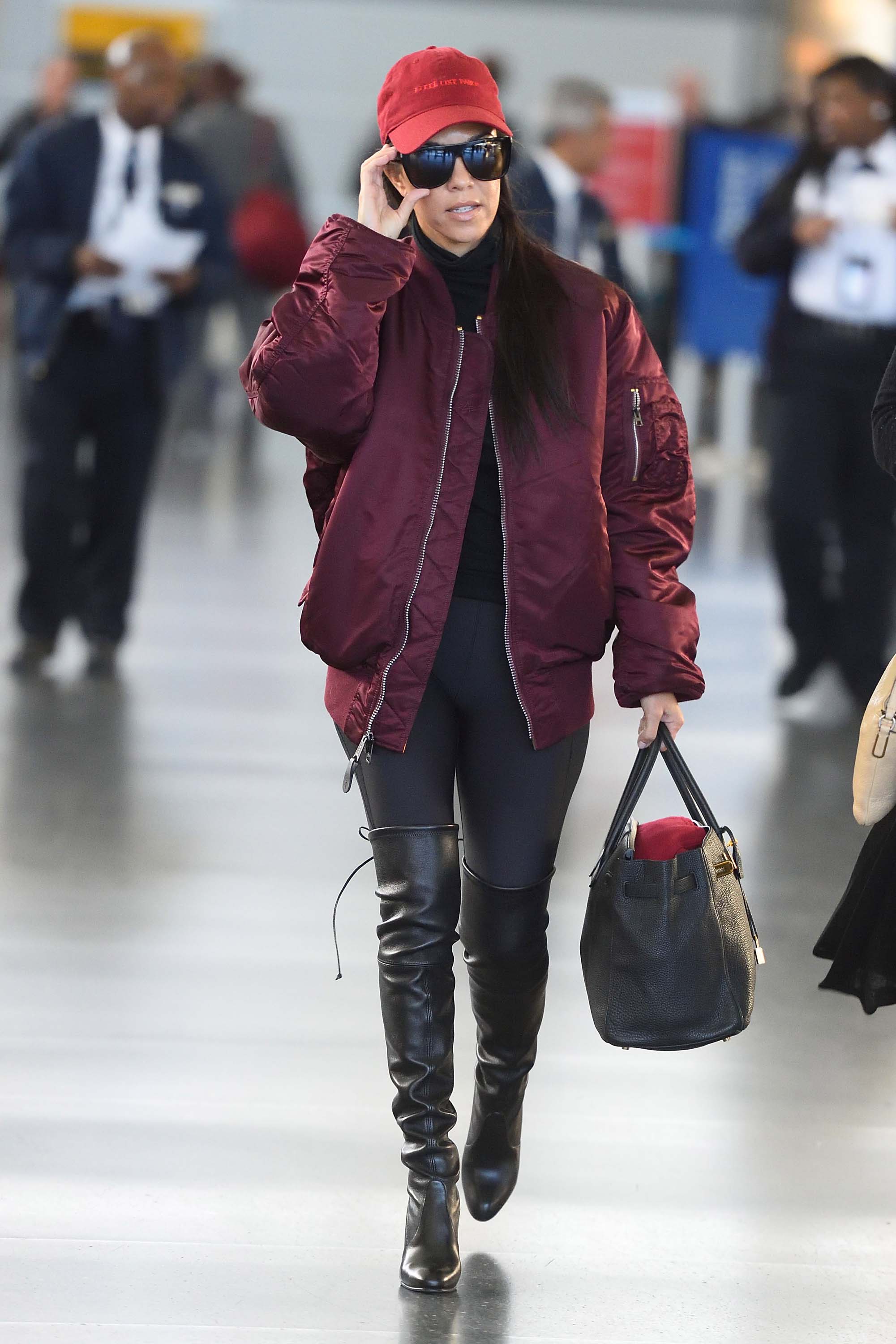 Kourtney Kardashian making her way through JFK airport