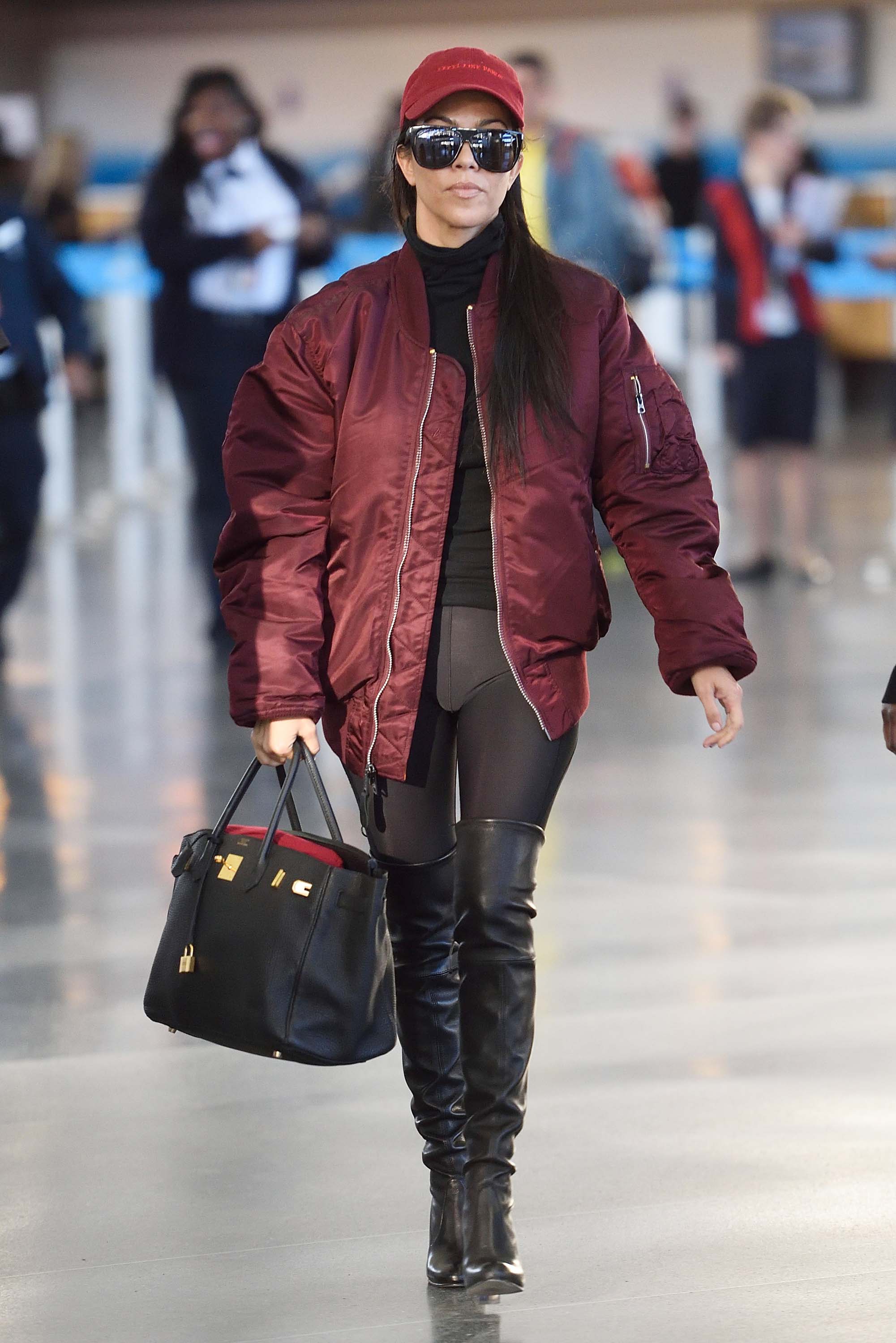 Kourtney Kardashian making her way through JFK airport