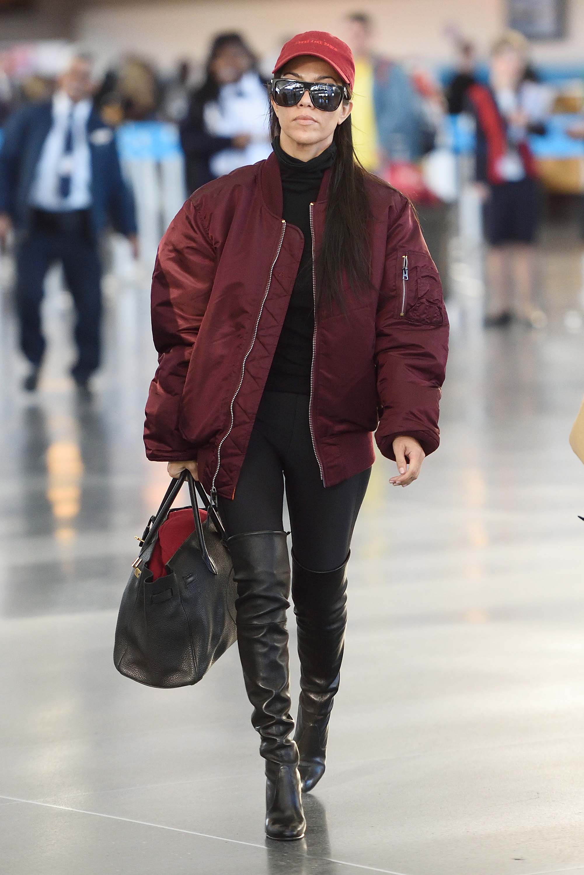 Kourtney Kardashian making her way through JFK airport