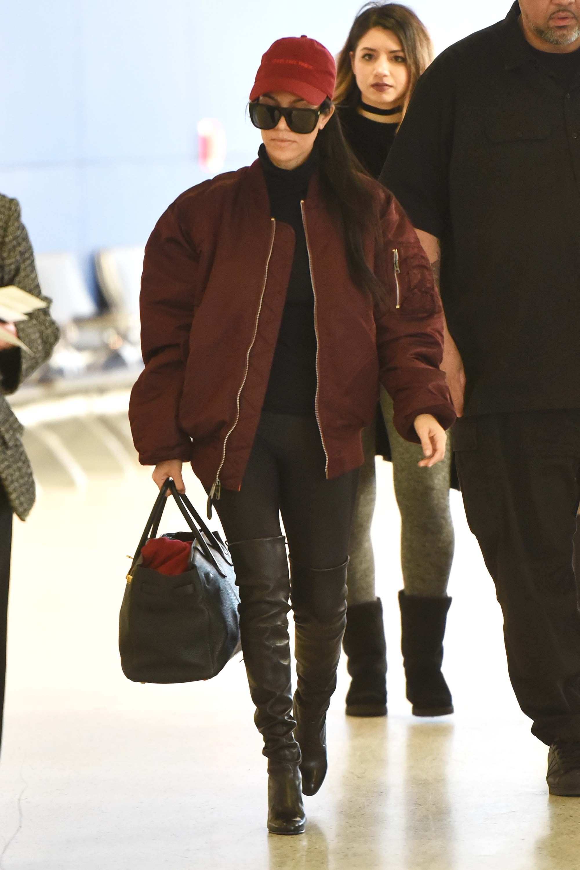 Kourtney Kardashian making her way through JFK airport