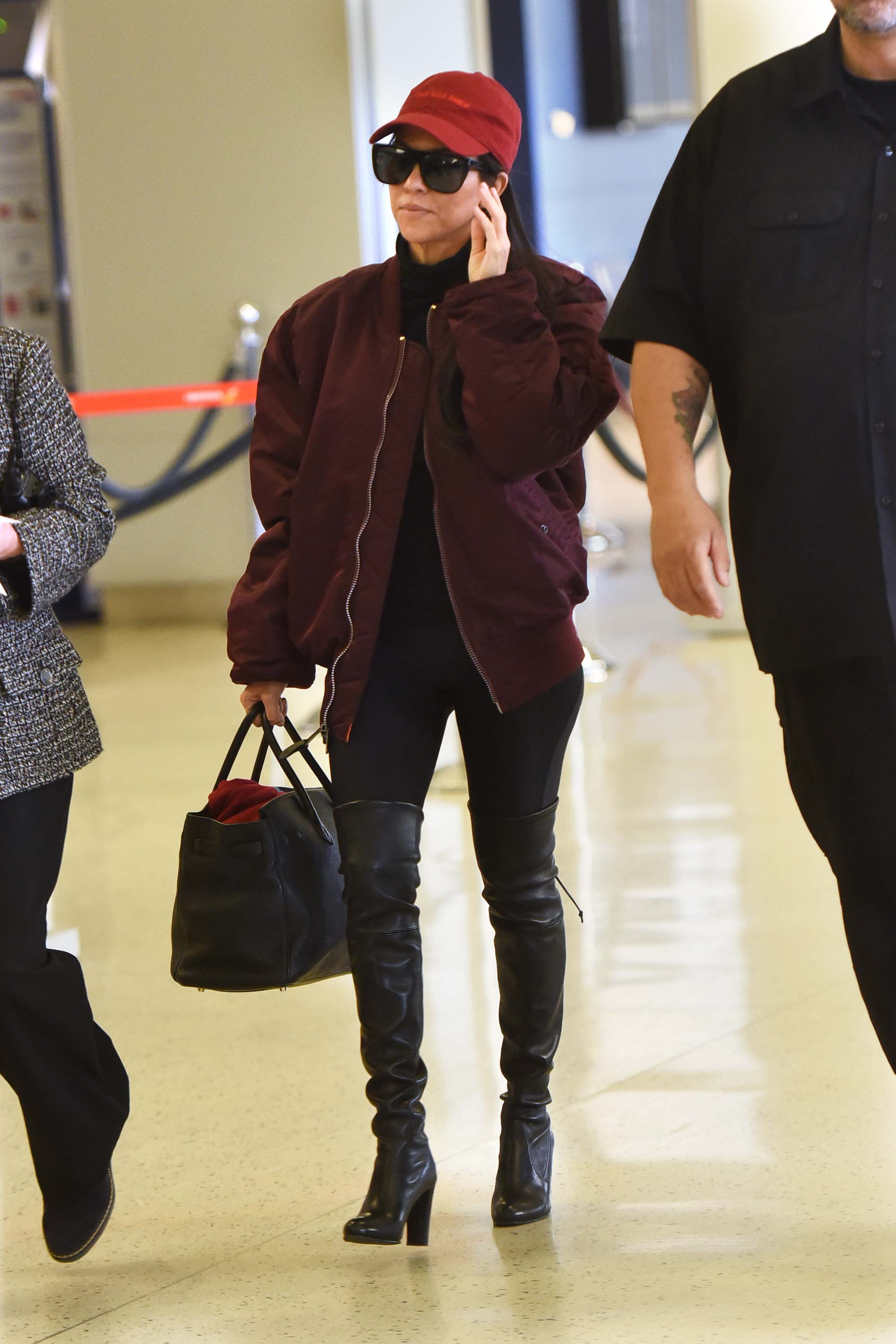 Kourtney Kardashian making her way through JFK airport