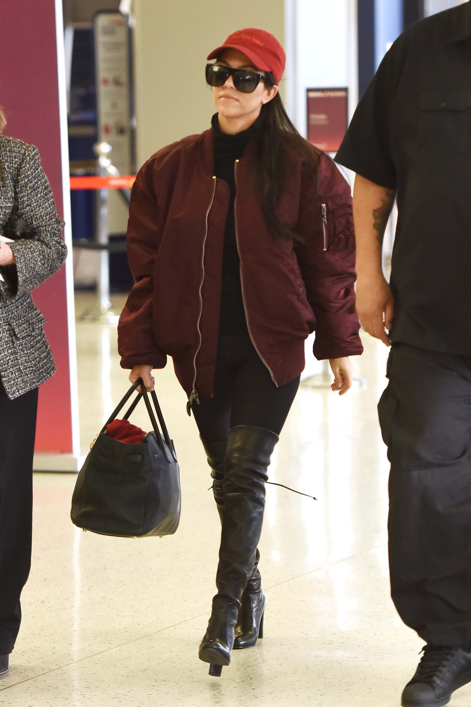 Kourtney Kardashian making her way through JFK airport
