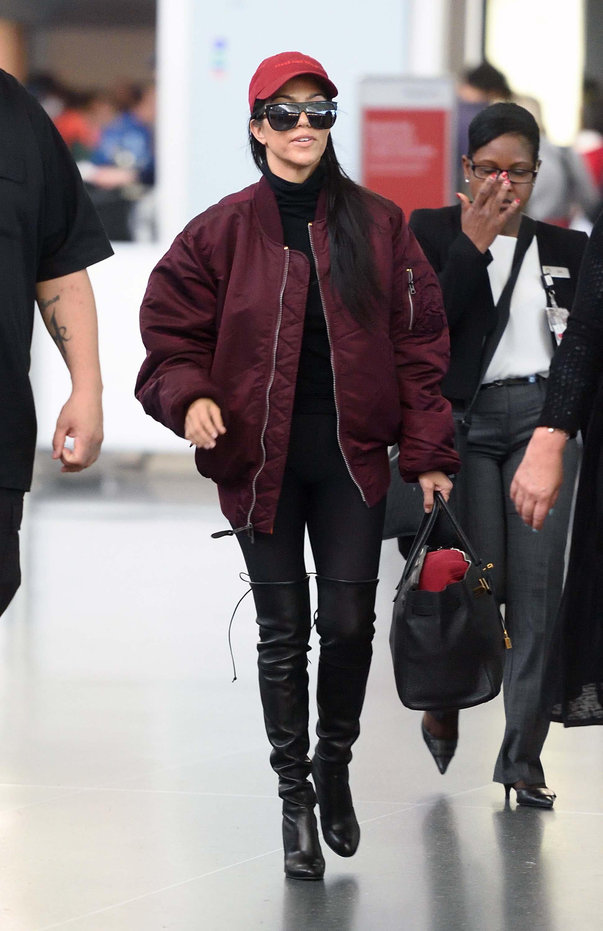 Kourtney Kardashian making her way through JFK airport