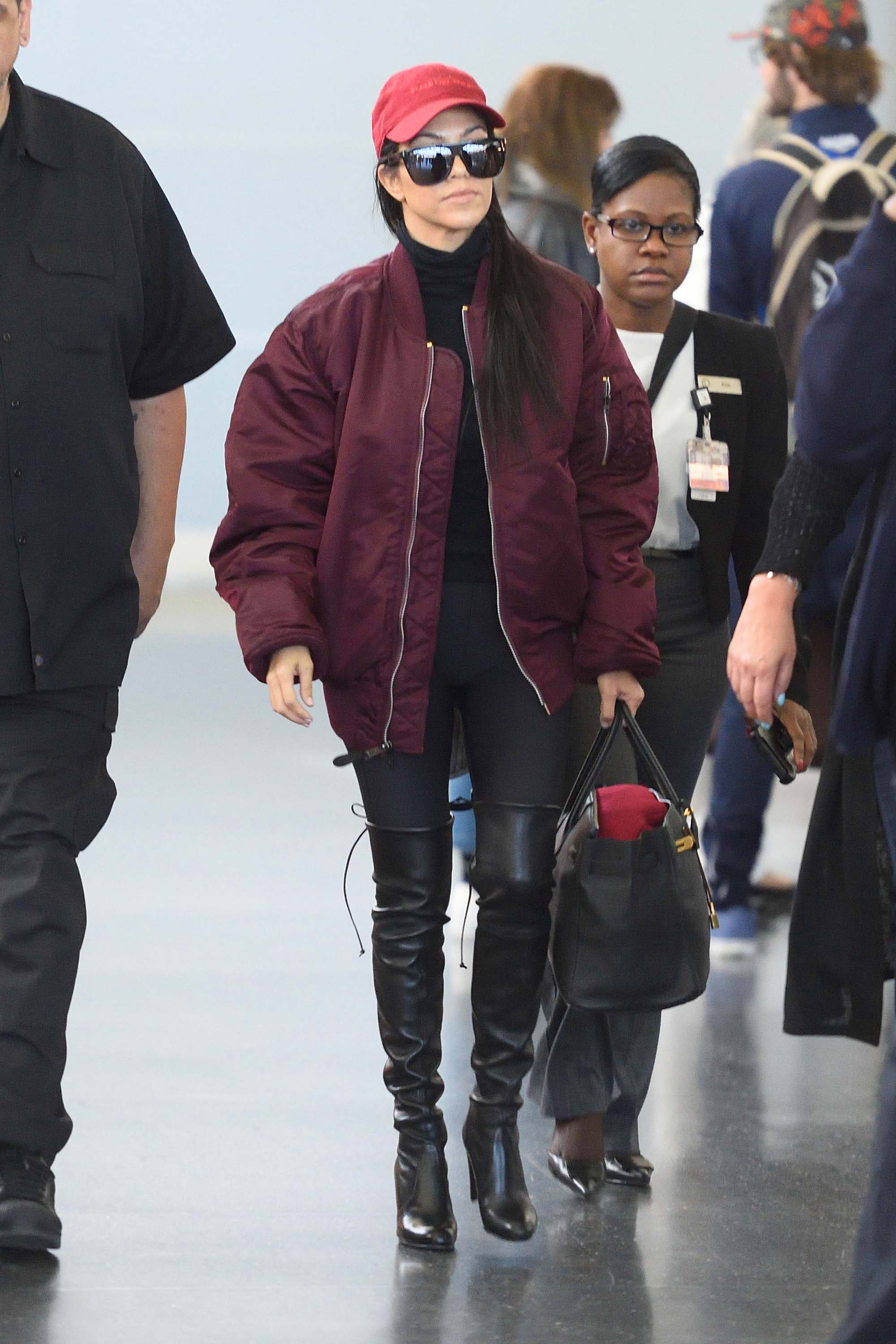 Kourtney Kardashian making her way through JFK airport