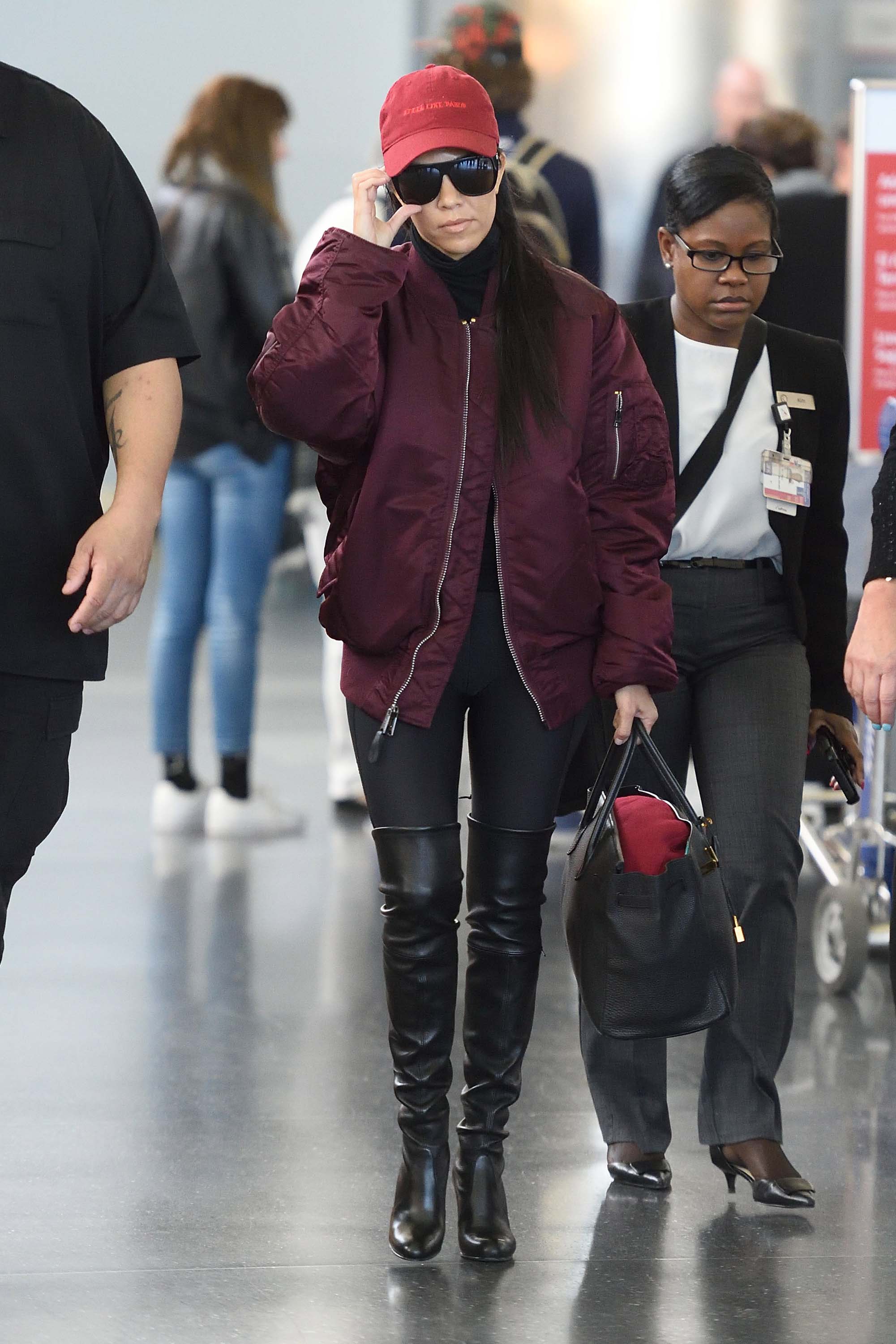 Kourtney Kardashian making her way through JFK airport