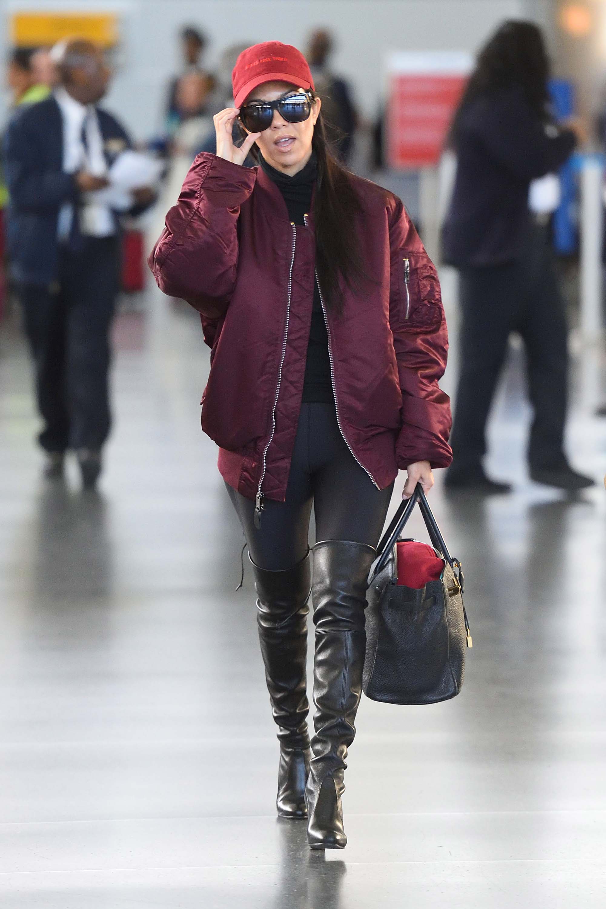 Kourtney Kardashian making her way through JFK airport