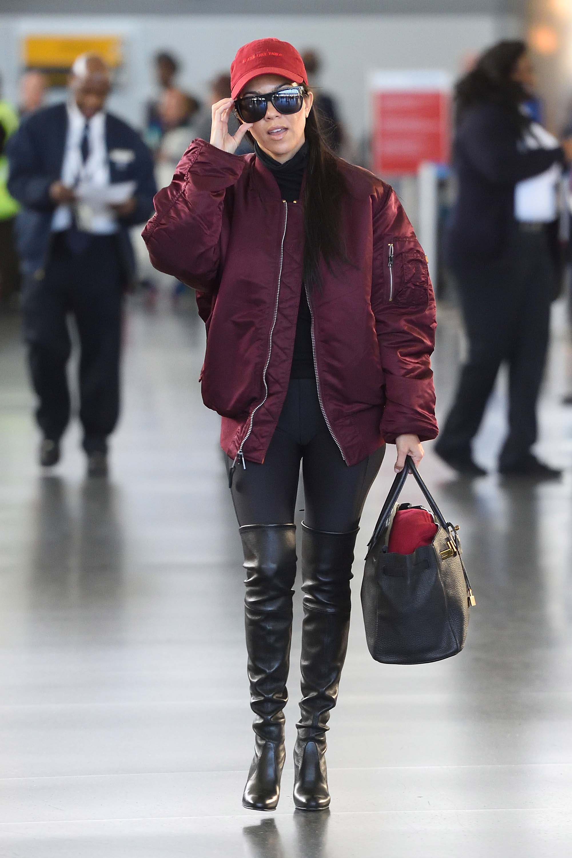 Kourtney Kardashian making her way through JFK airport