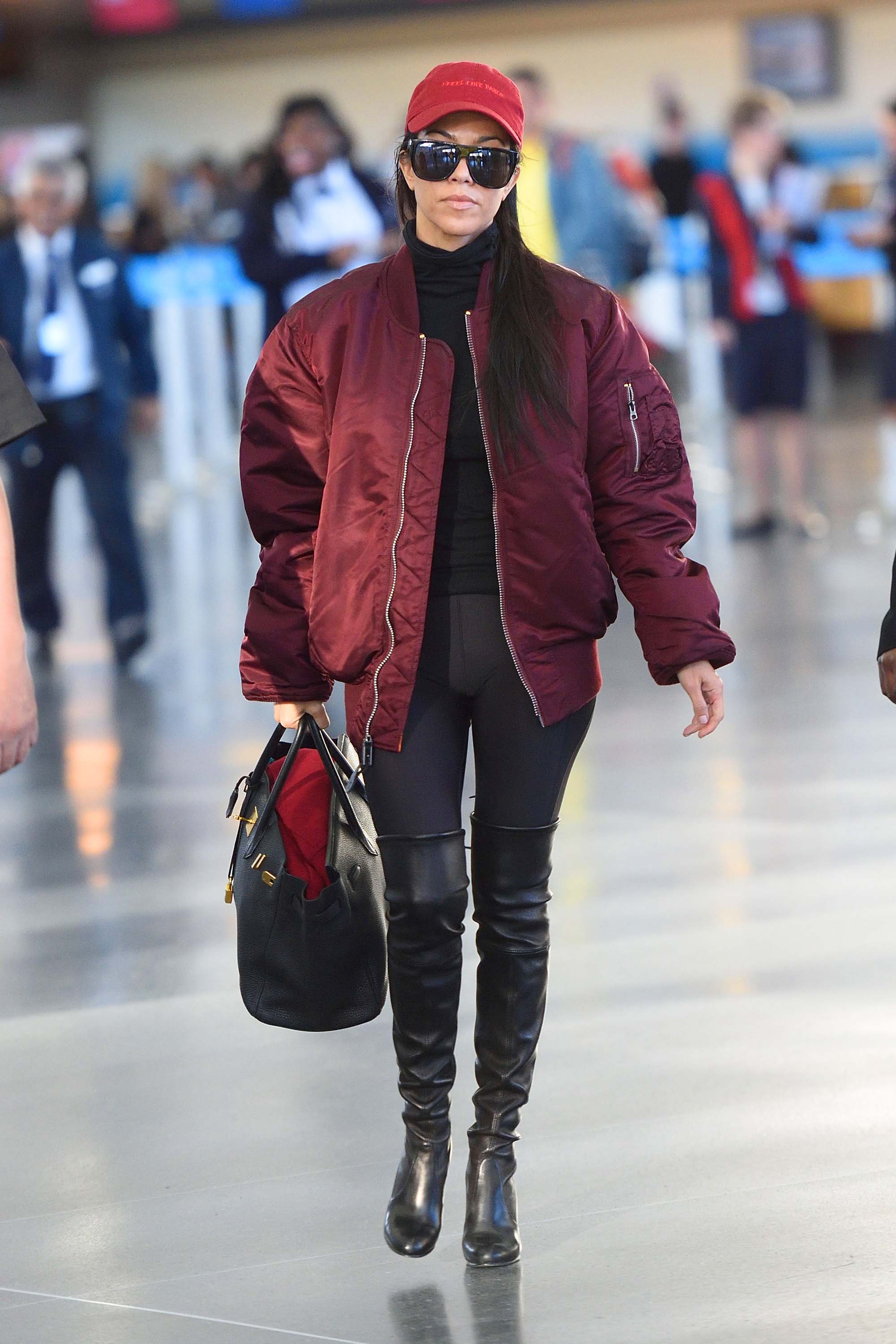 Kourtney Kardashian making her way through JFK airport