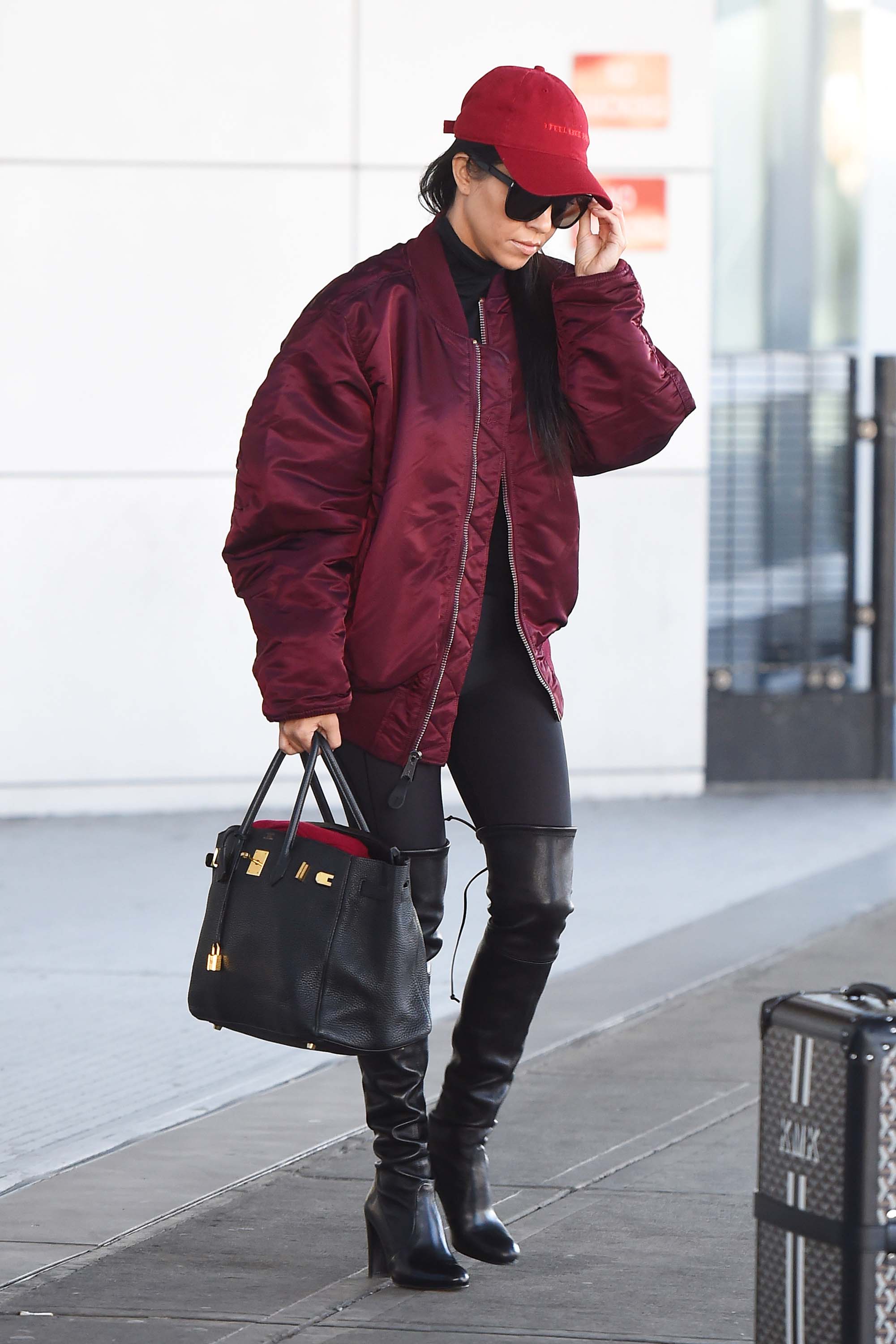 Kourtney Kardashian making her way through JFK airport