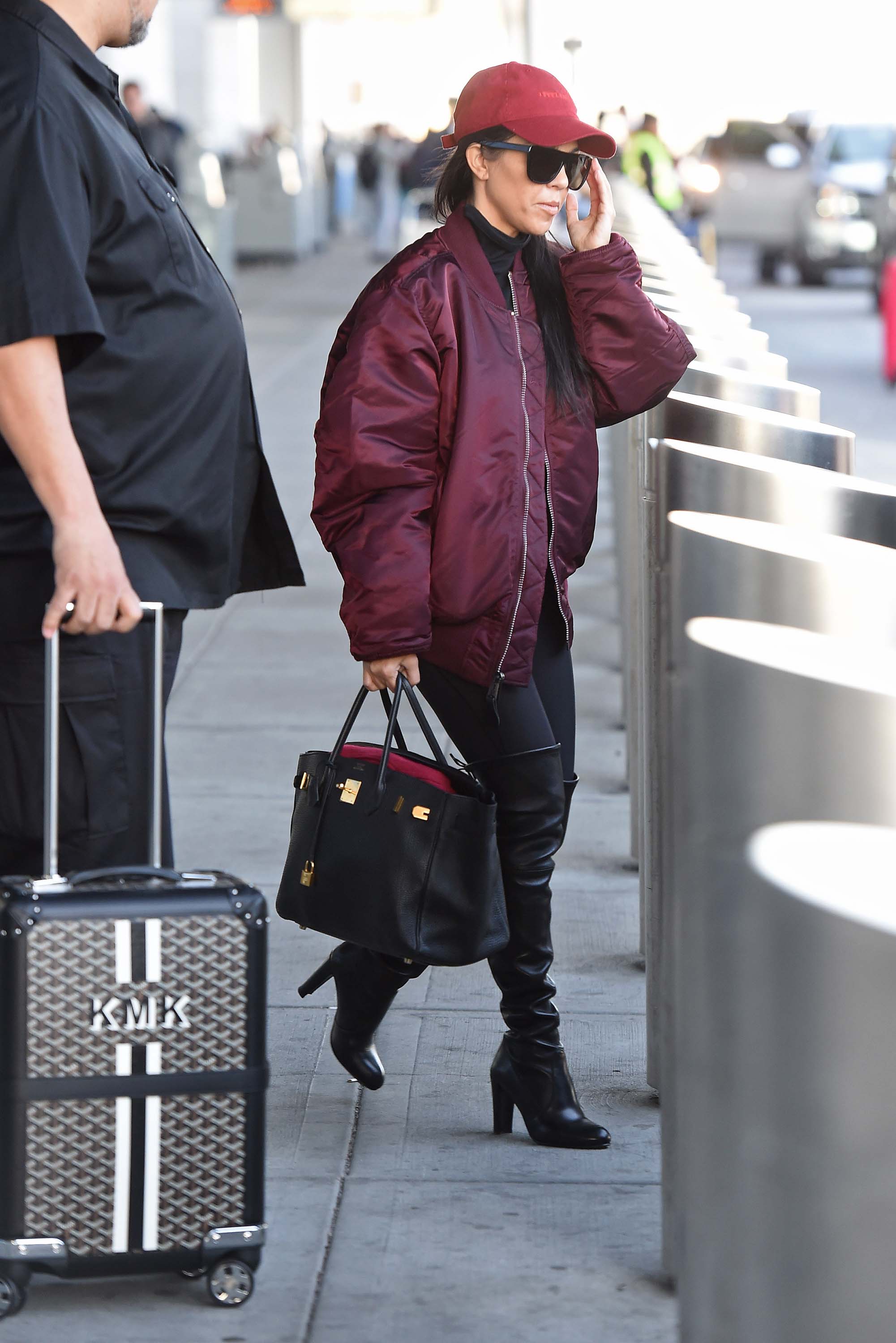 Kourtney Kardashian making her way through JFK airport