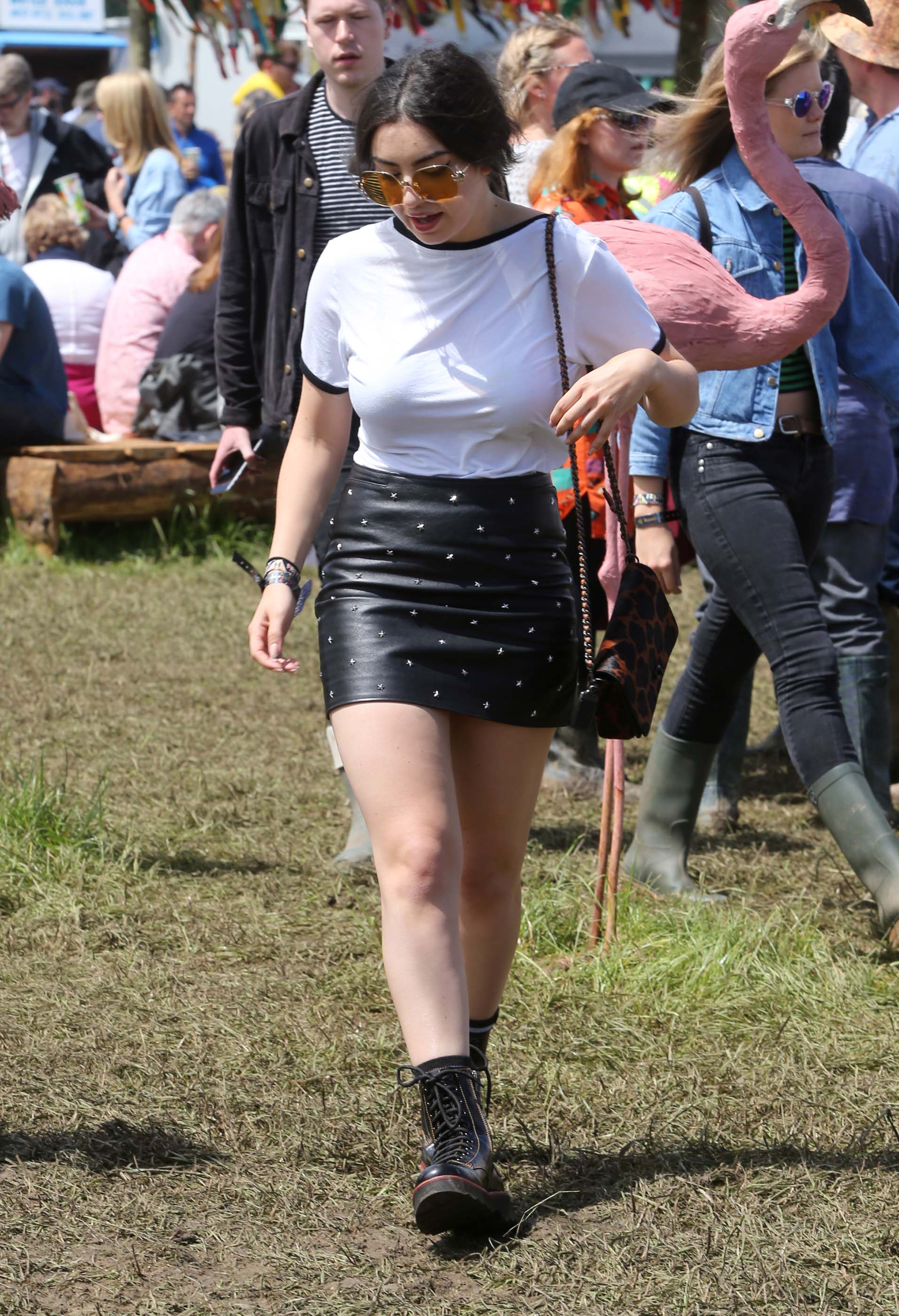 Charlie XCX wearing Coach attends the Glastonbury Festival