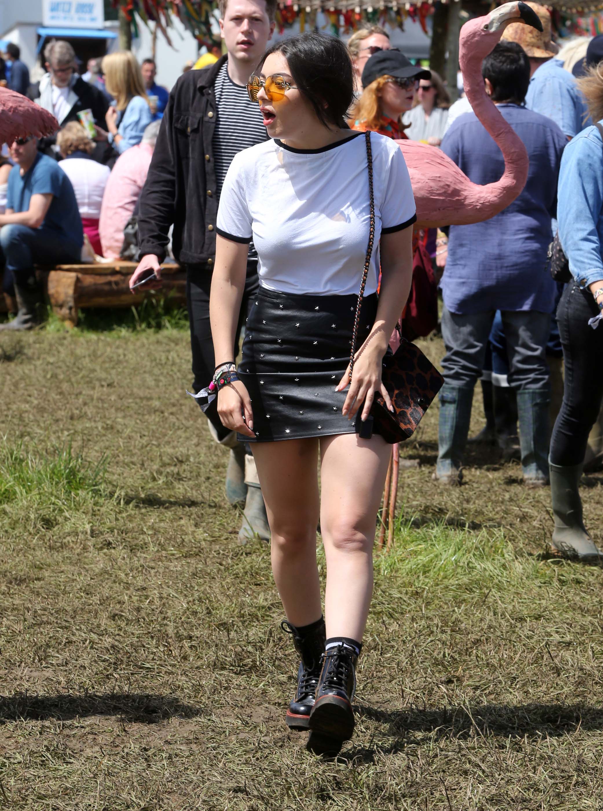 Charlie XCX wearing Coach attends the Glastonbury Festival