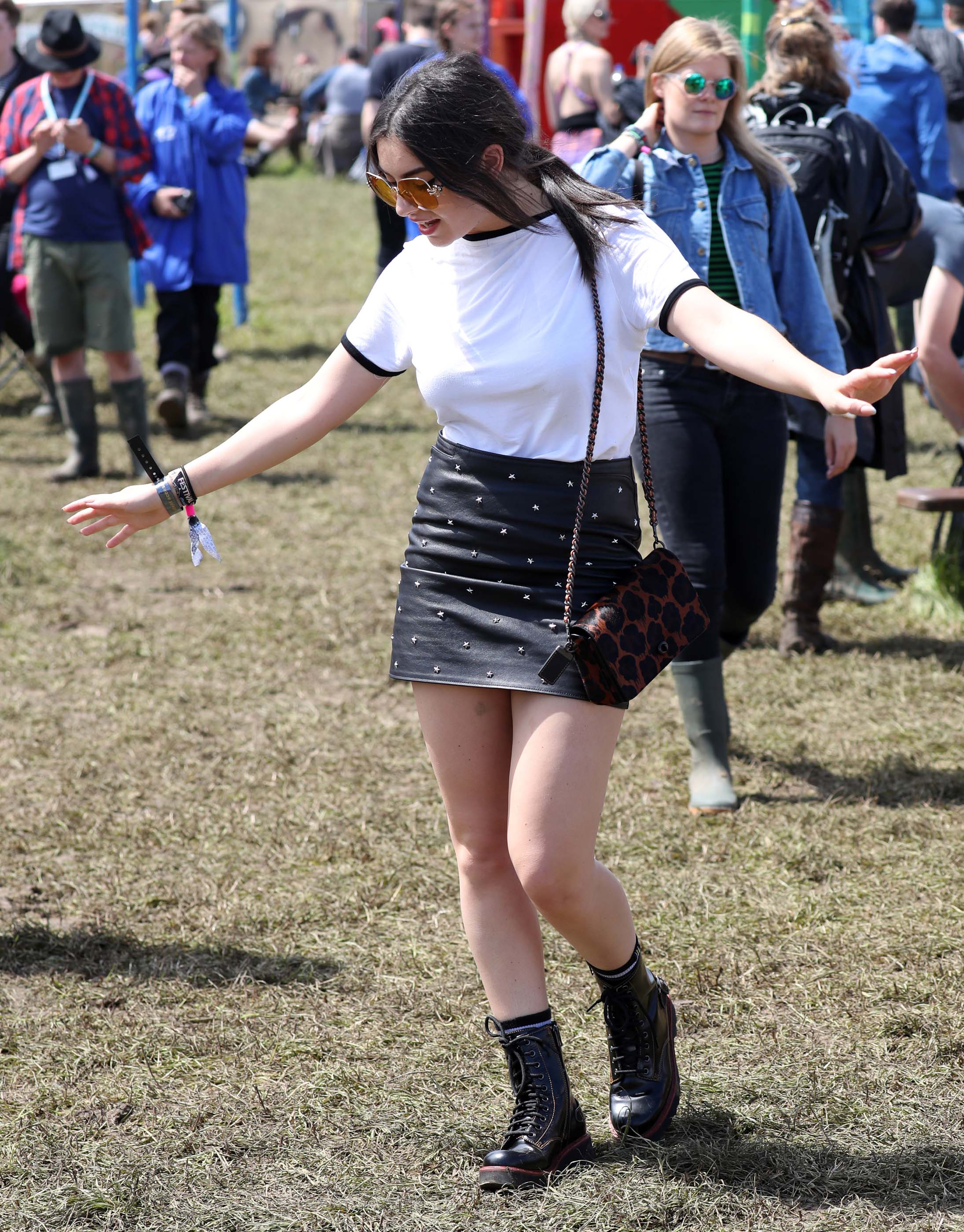 Charlie XCX wearing Coach attends the Glastonbury Festival