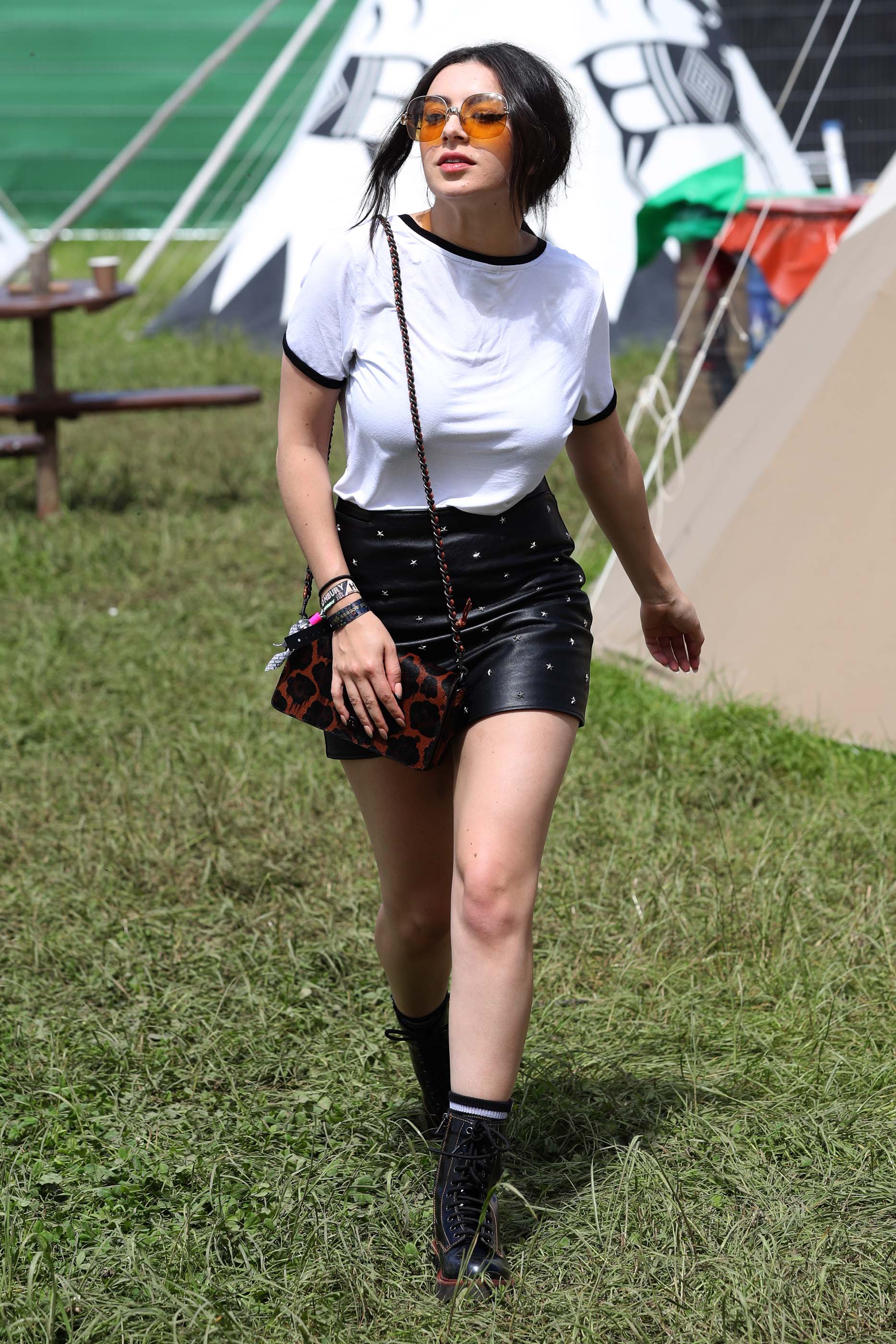 Charlie XCX wearing Coach attends the Glastonbury Festival