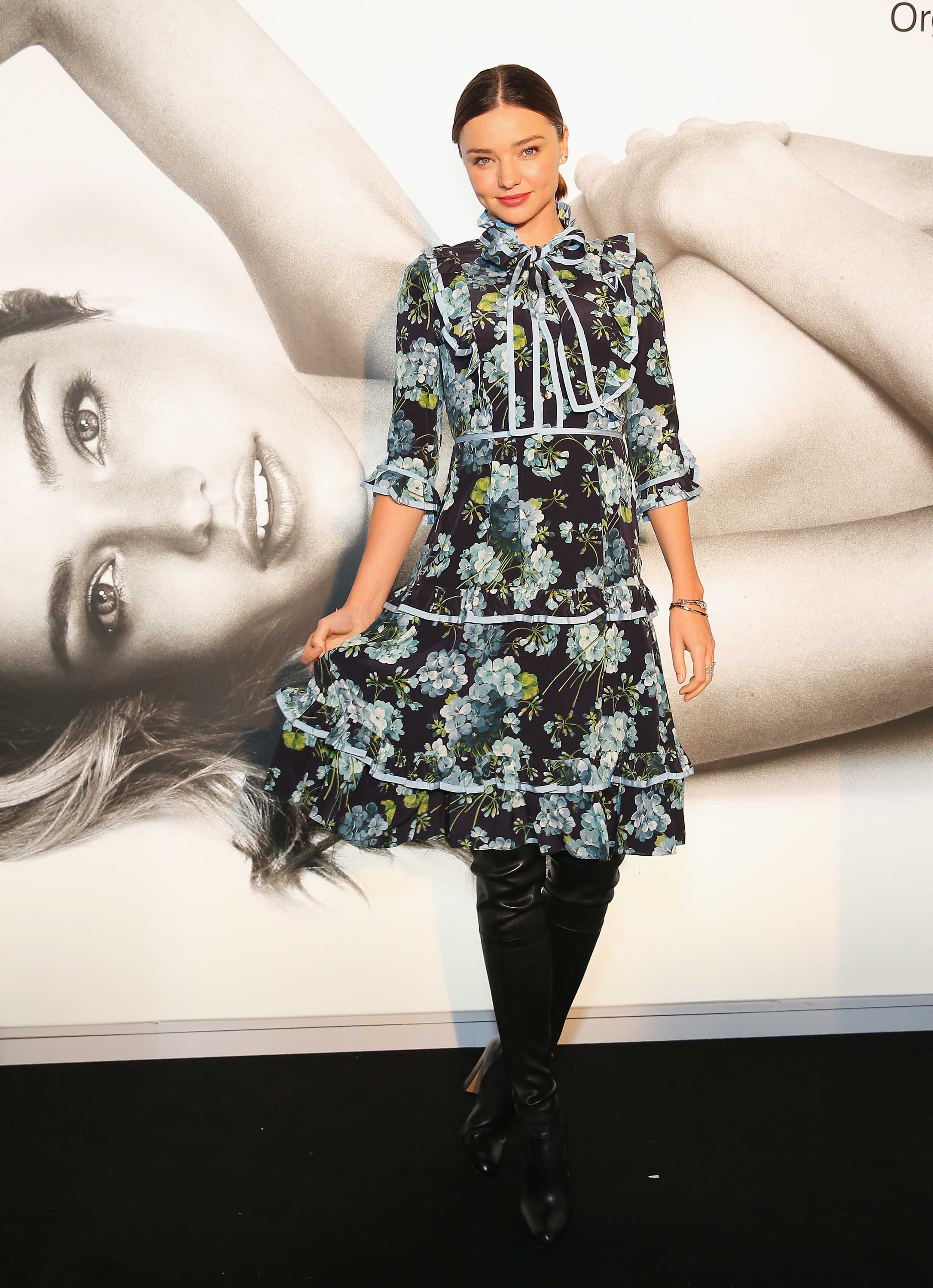 Miranda Kerr poses before she greets fans at Westfield