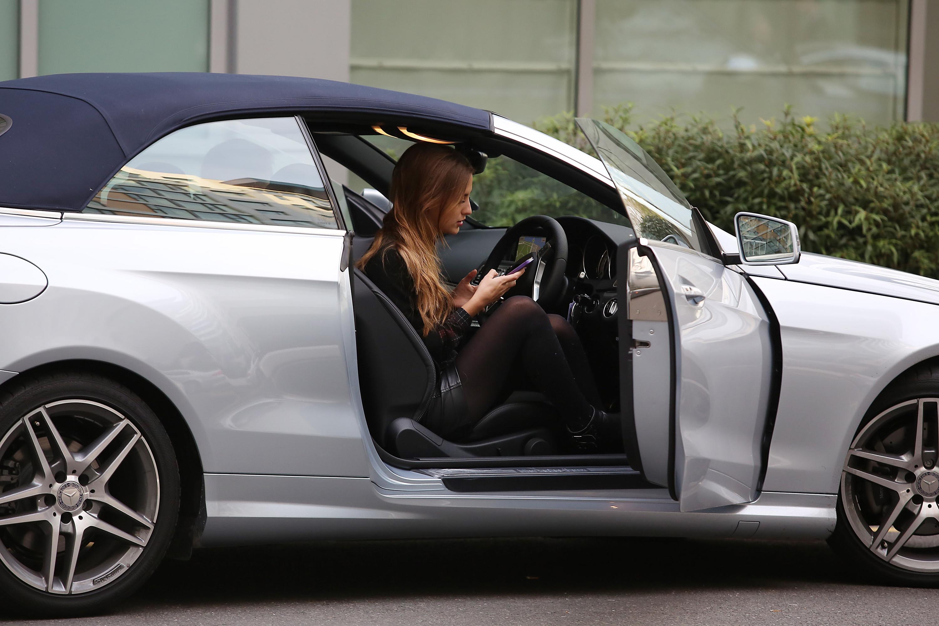 Lucy Watson seen picking up the keys to her new Mercedes