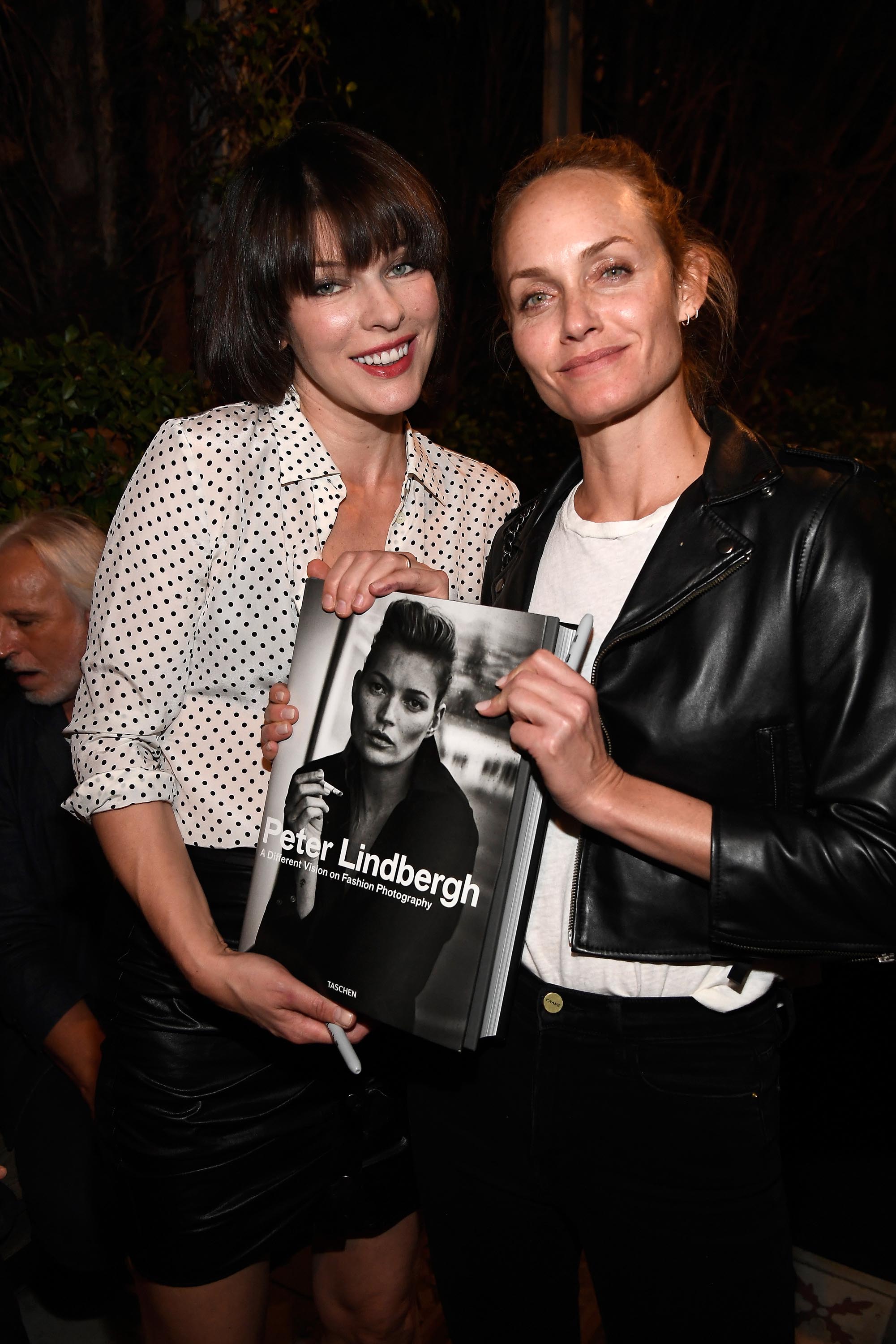 Milla Jovovich attends photographer Peter Lindbergh Book Signing