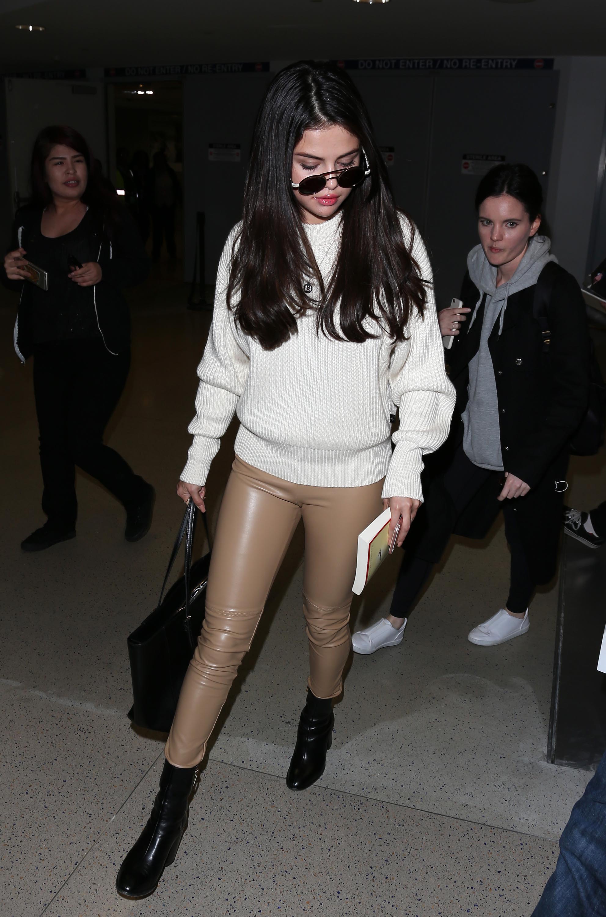 Selena Gomez arriving at LAX