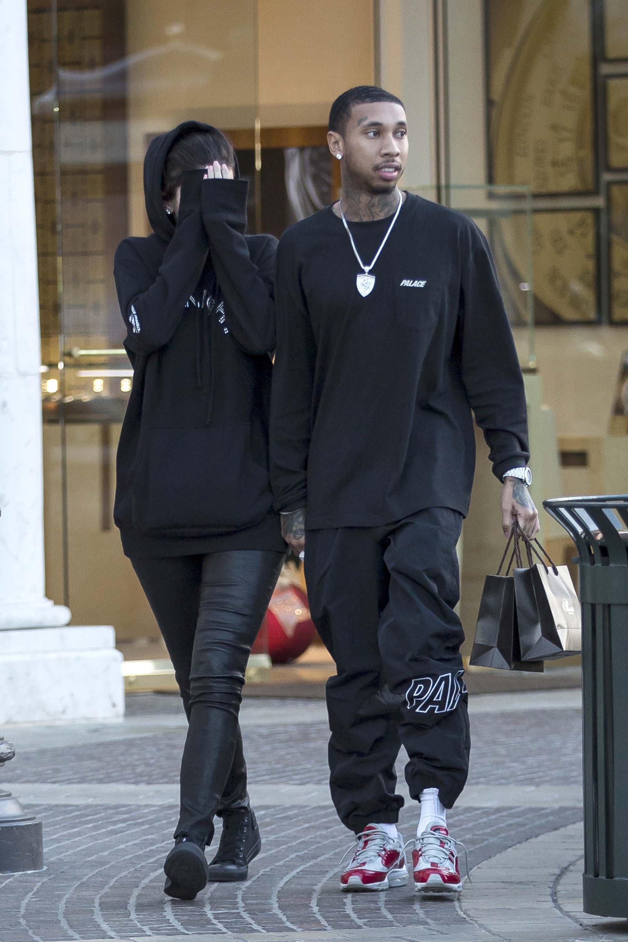 Kylie Jenner Covers her face after picking out jewelry