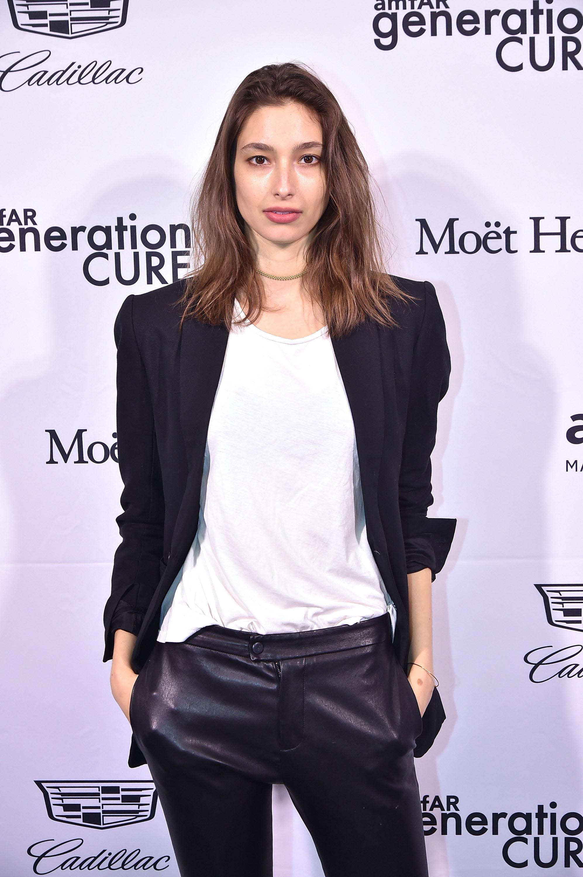 Alexandra Agoston attends the 2016 amfAR GenerationCure Holiday Party