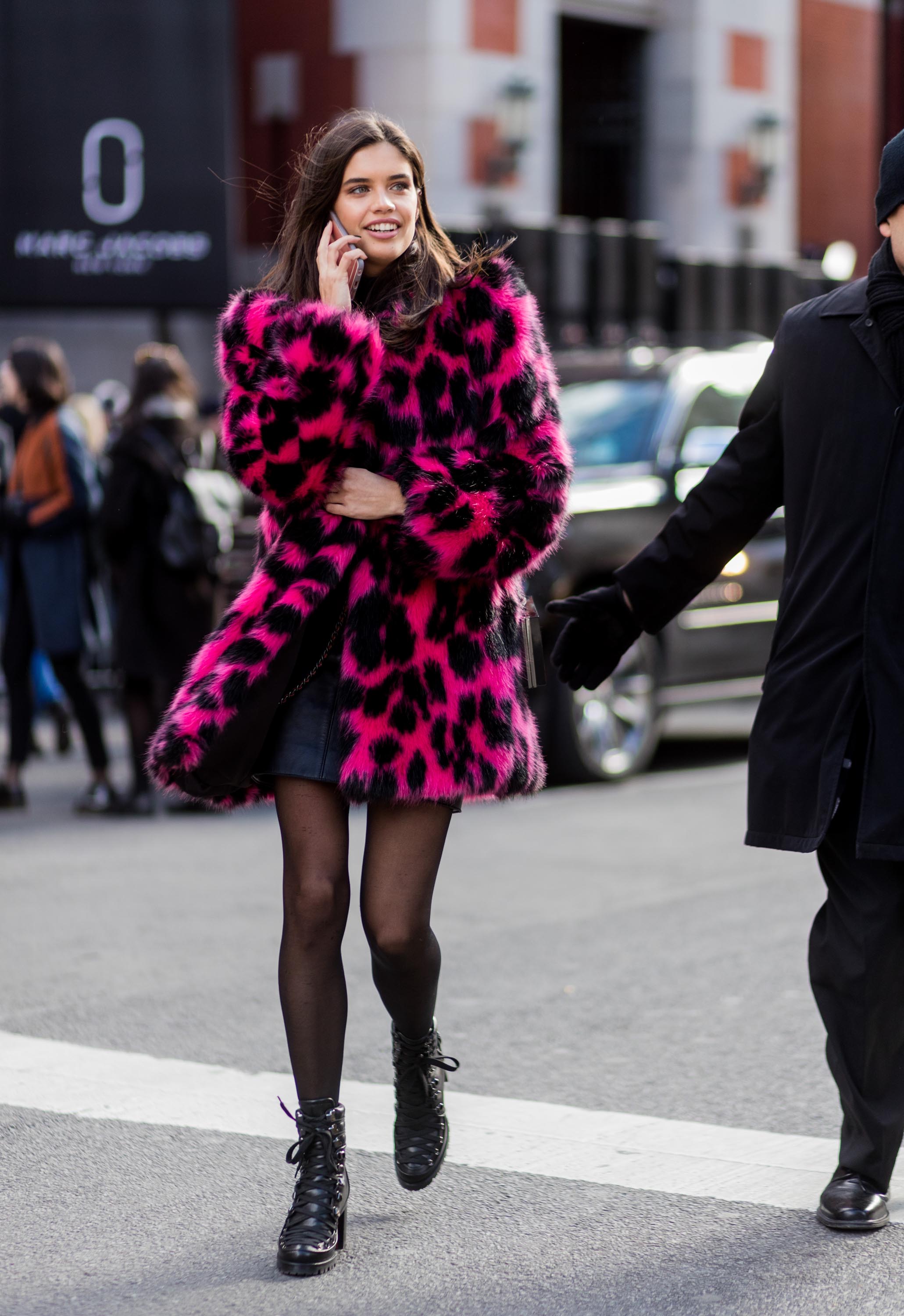 Sara Sampaio wearing a pink black leoprint coat outside Marc Jacobs