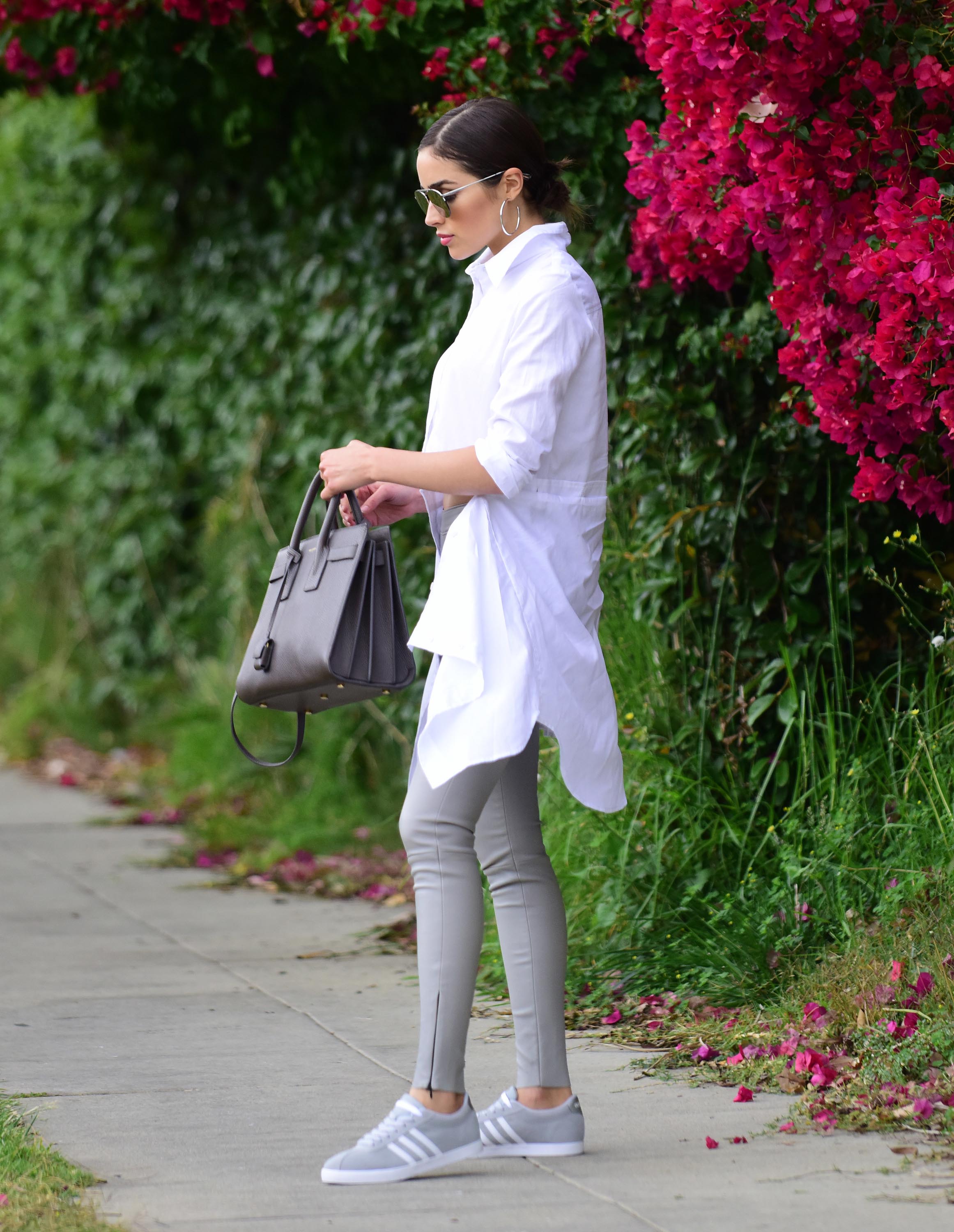 Olivia Culpo poses on set of a photoshoot