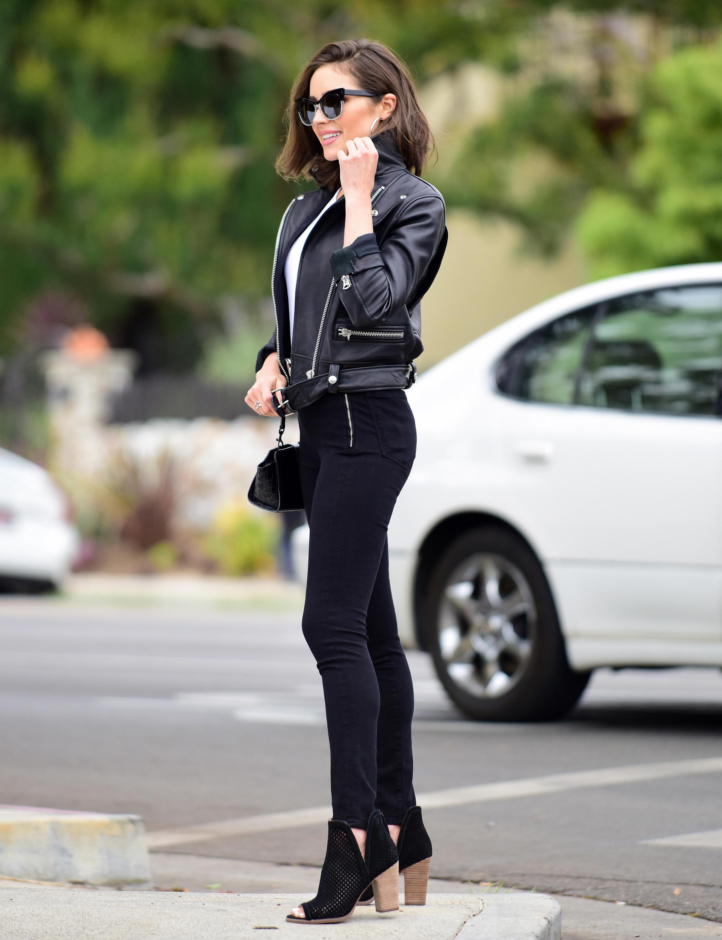 Olivia Culpo poses on set of a photoshoot