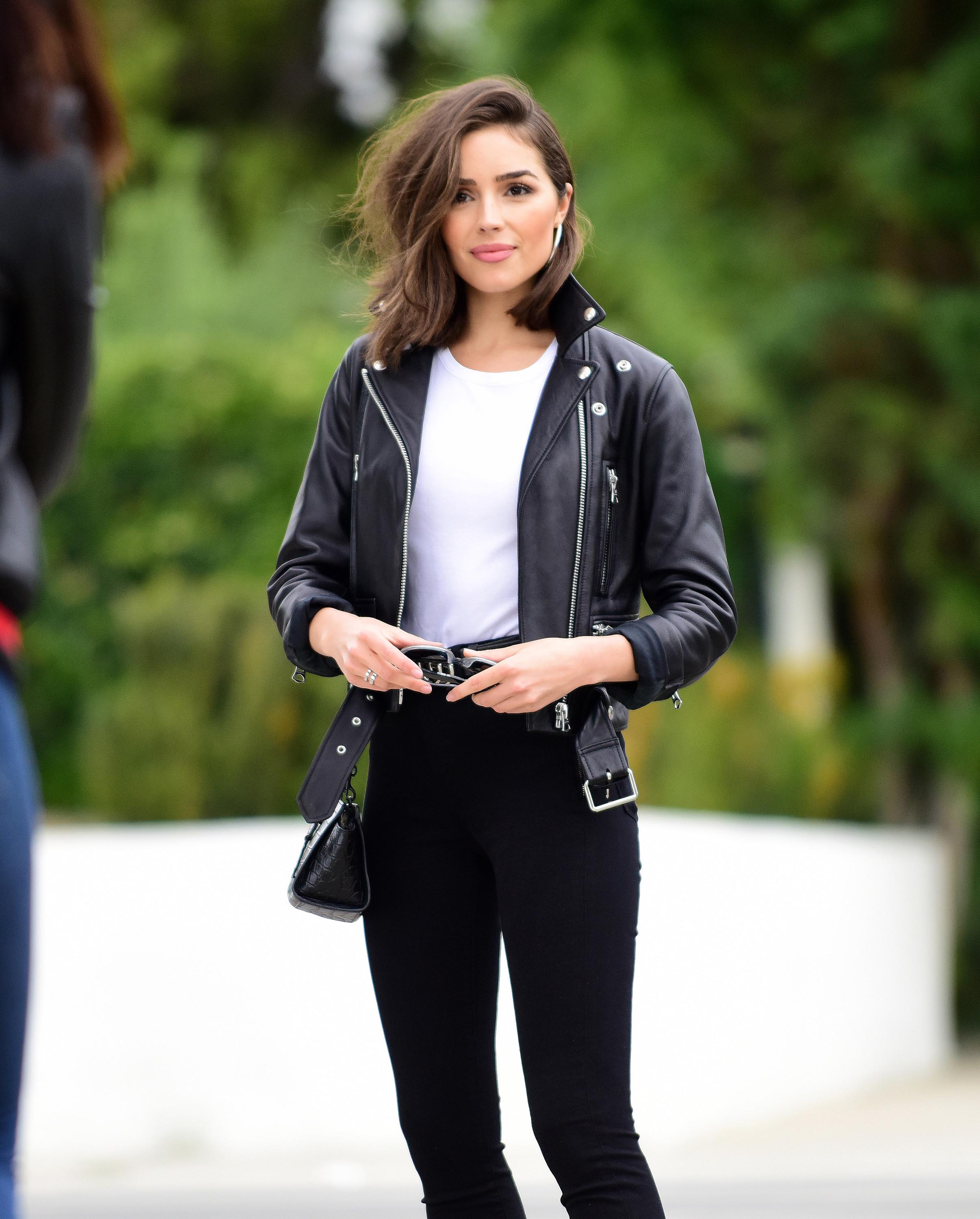 Olivia Culpo poses on set of a photoshoot