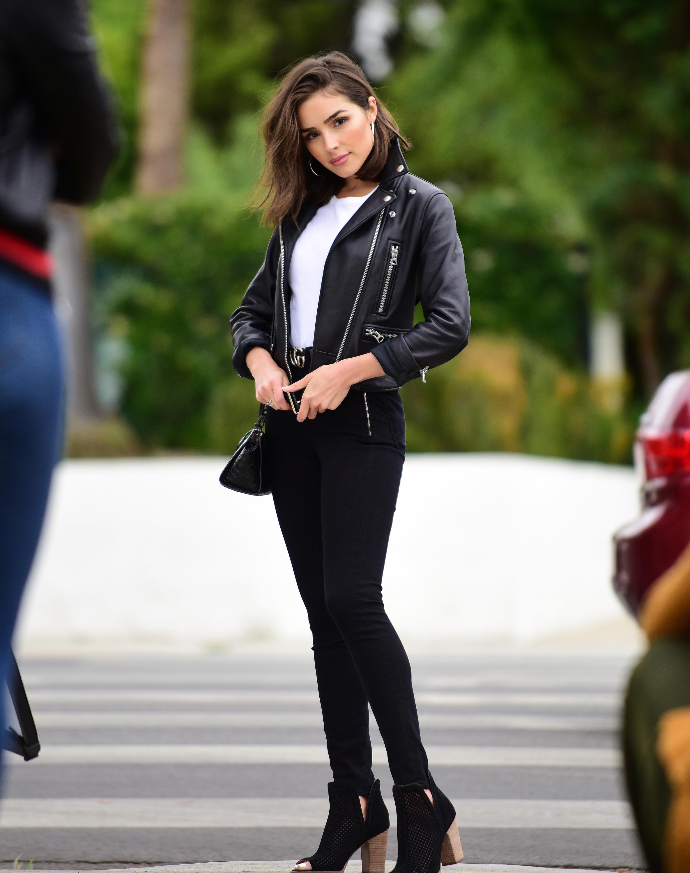 Olivia Culpo poses on set of a photoshoot