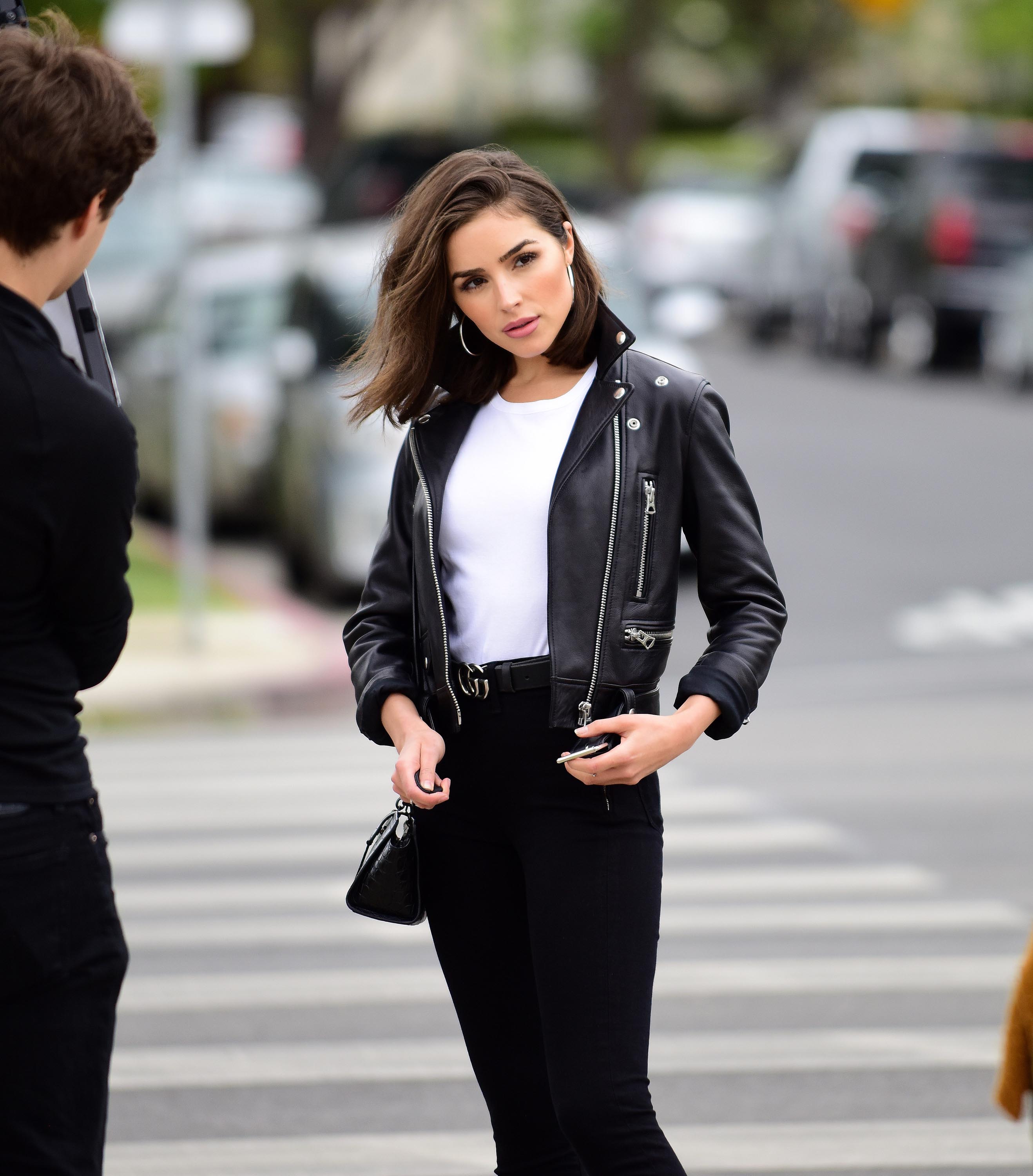 Olivia Culpo poses on set of a photoshoot