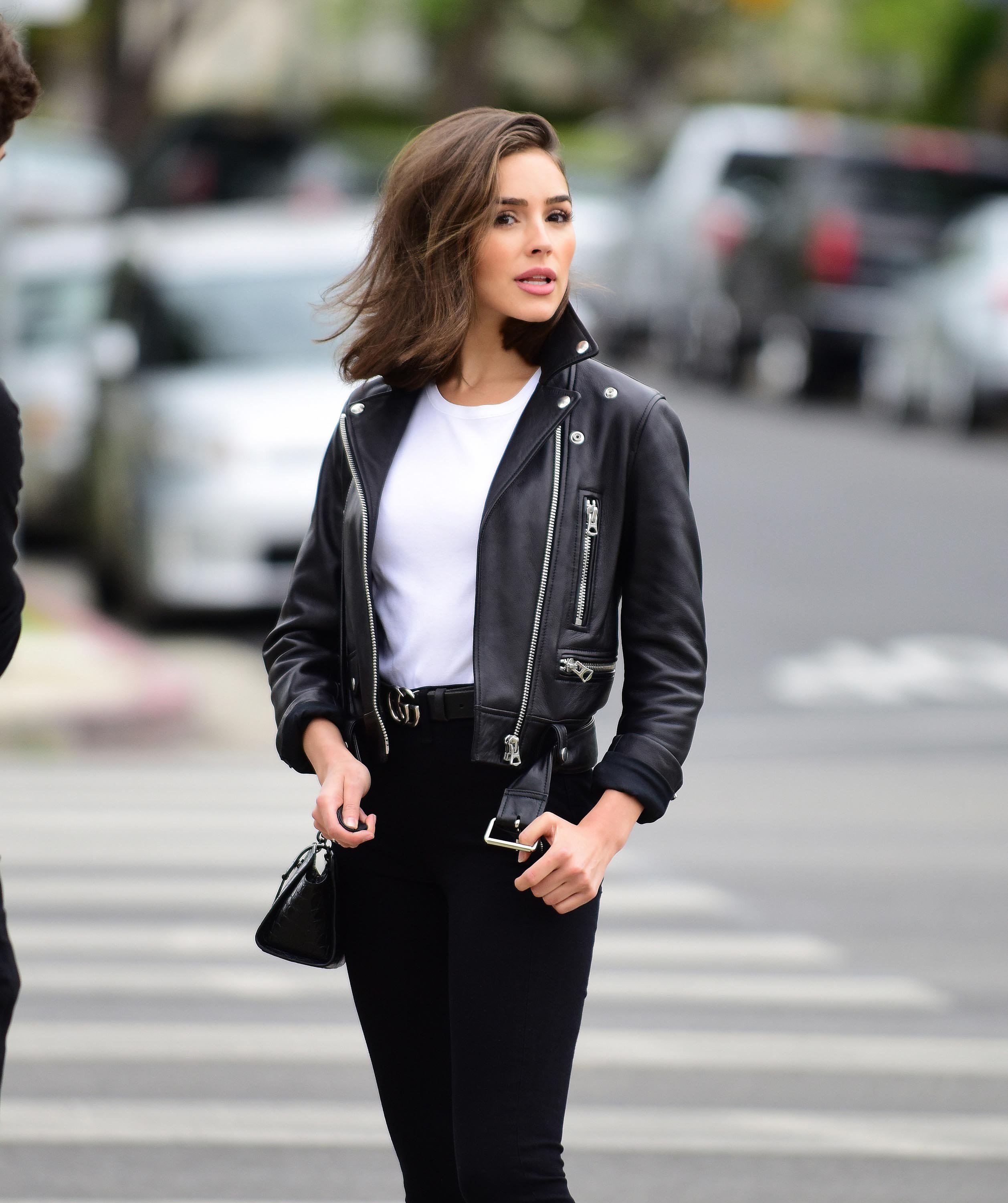 Olivia Culpo poses on set of a photoshoot