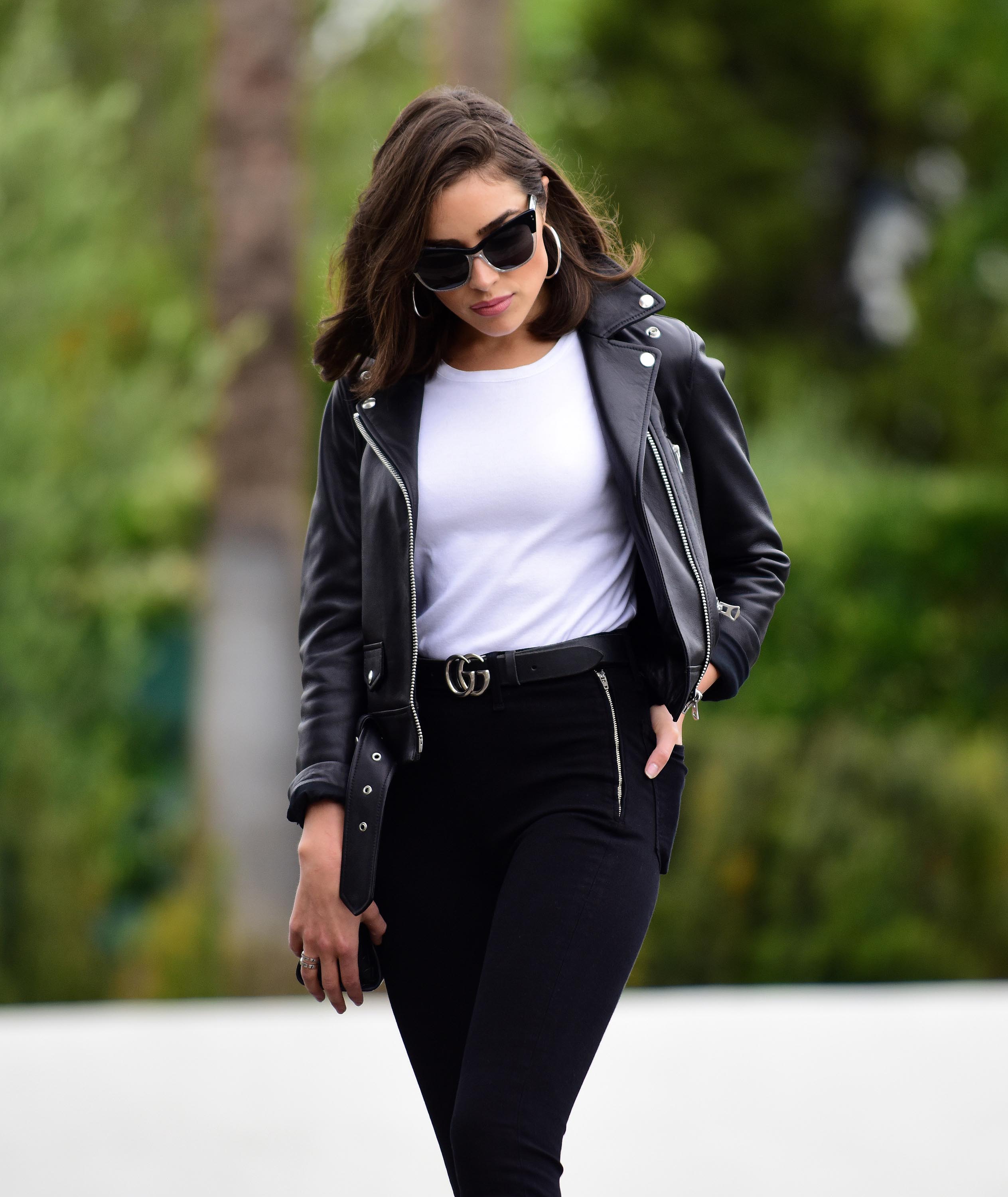 Olivia Culpo poses on set of a photoshoot