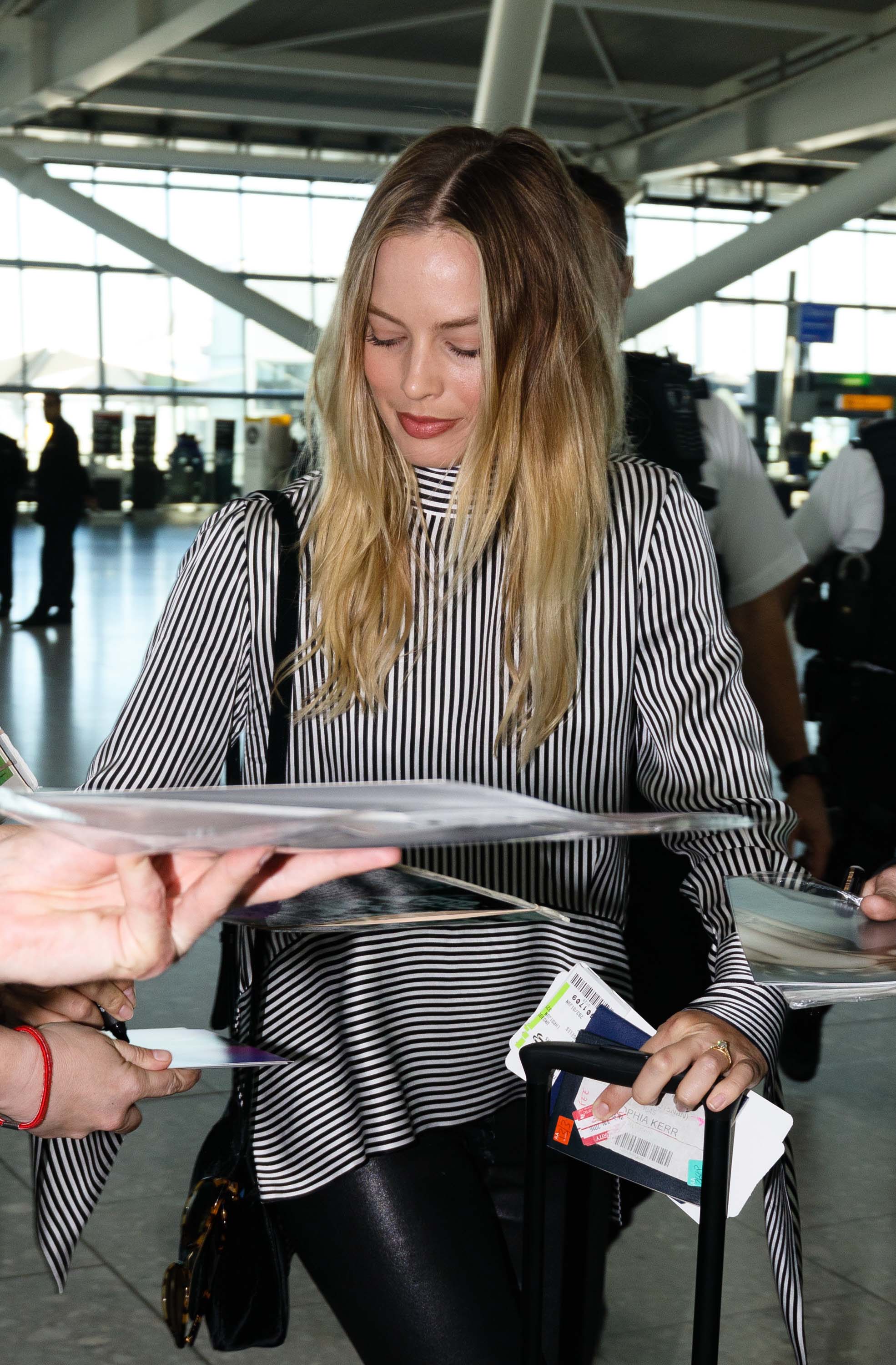 Margot Robbie seen at Heathrow airport