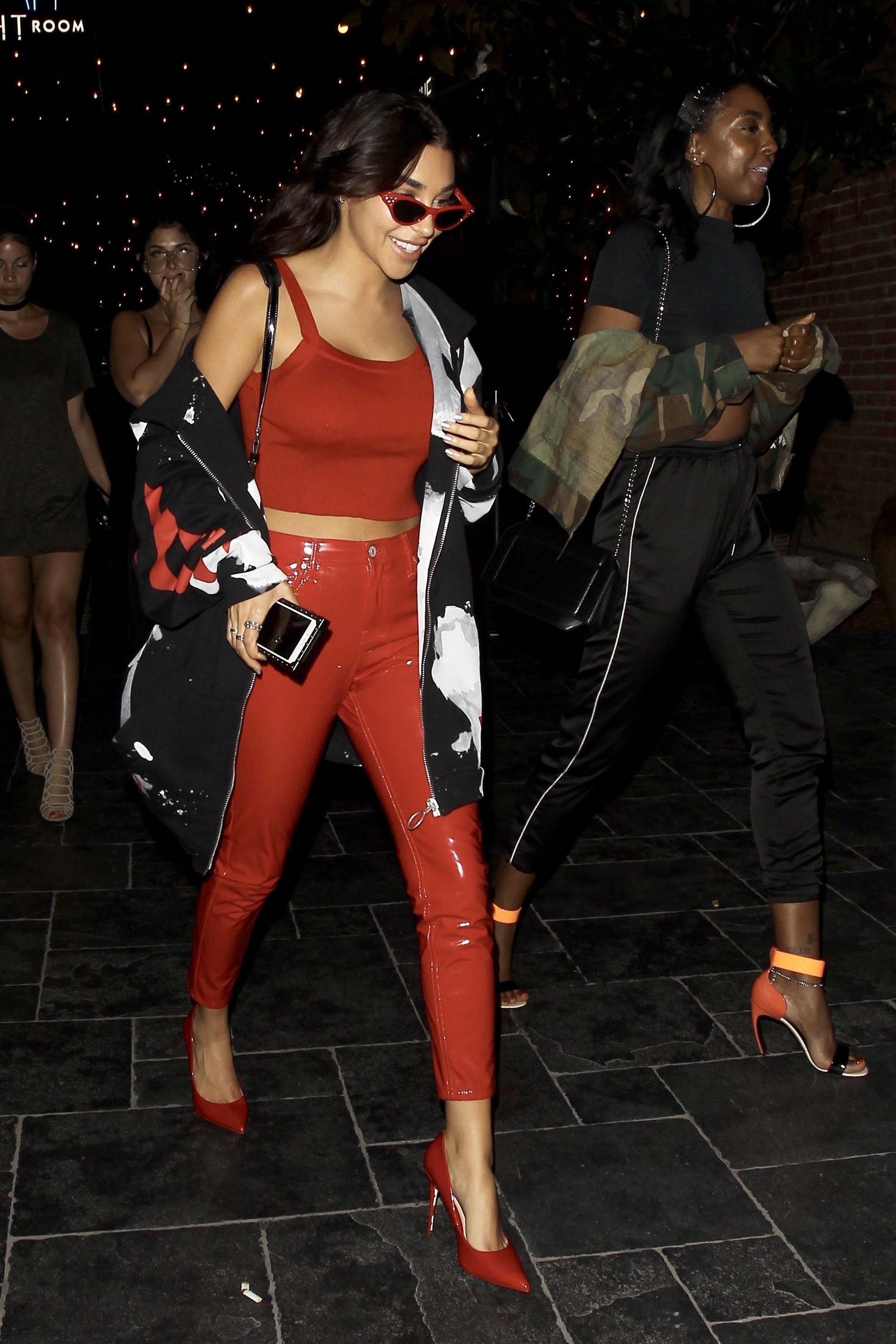 Chantel Jeffries smiles and poses for photos in a red hot form fitting outfit