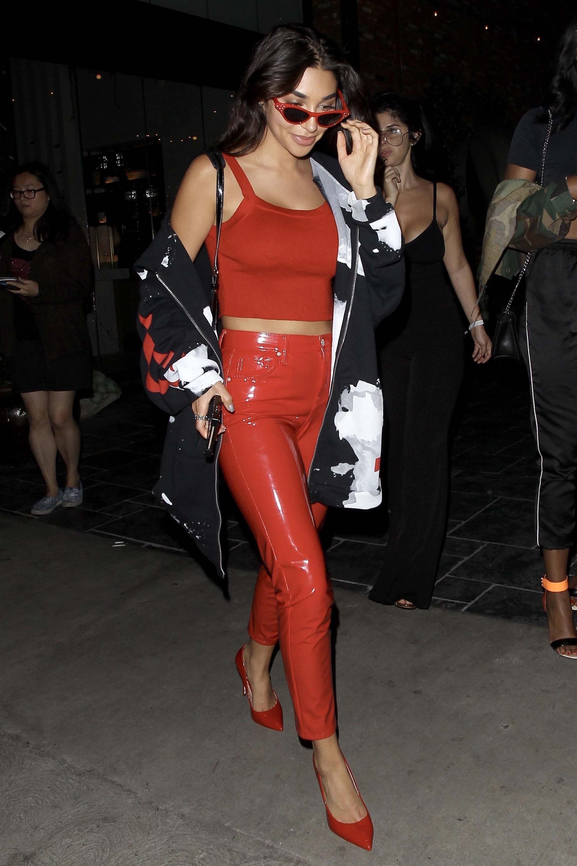 Chantel Jeffries smiles and poses for photos in a red hot form fitting outfit