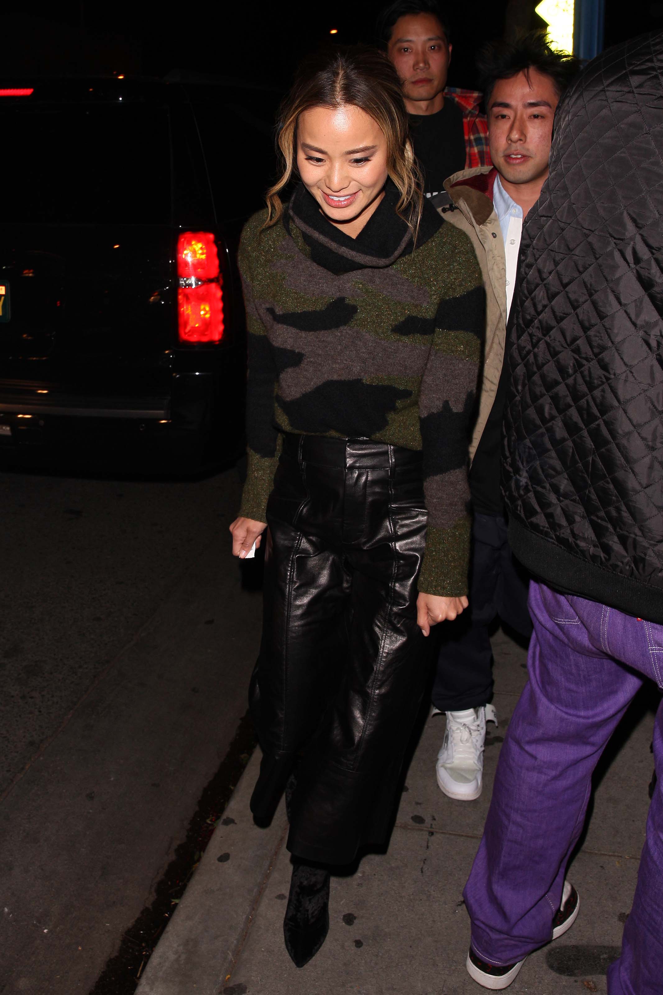 Jamie Chung leaves the Delilah club with a male friend