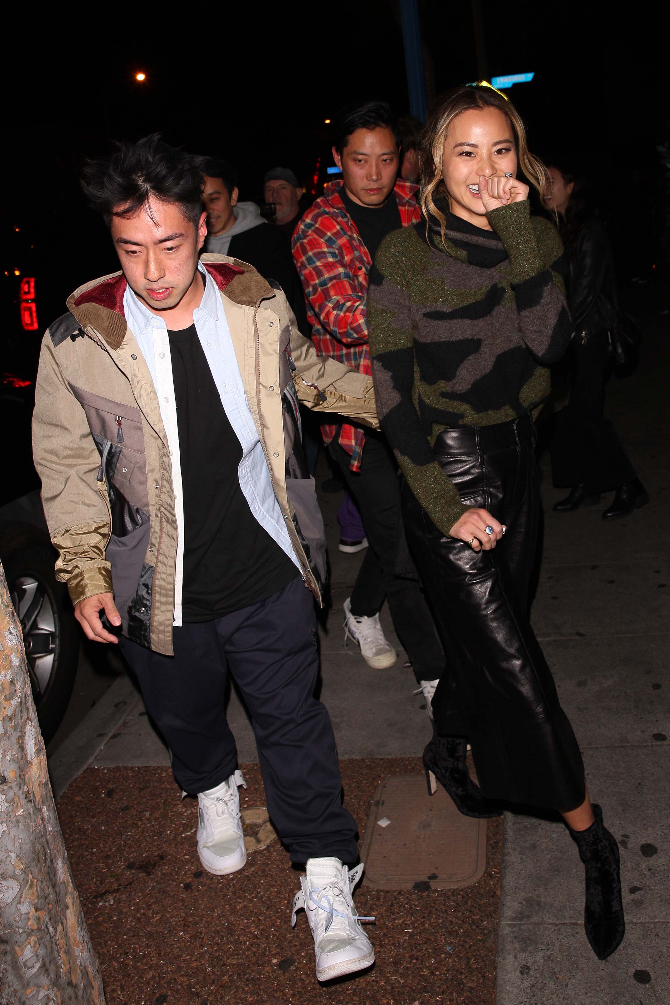 Jamie Chung leaves the Delilah club with a male friend