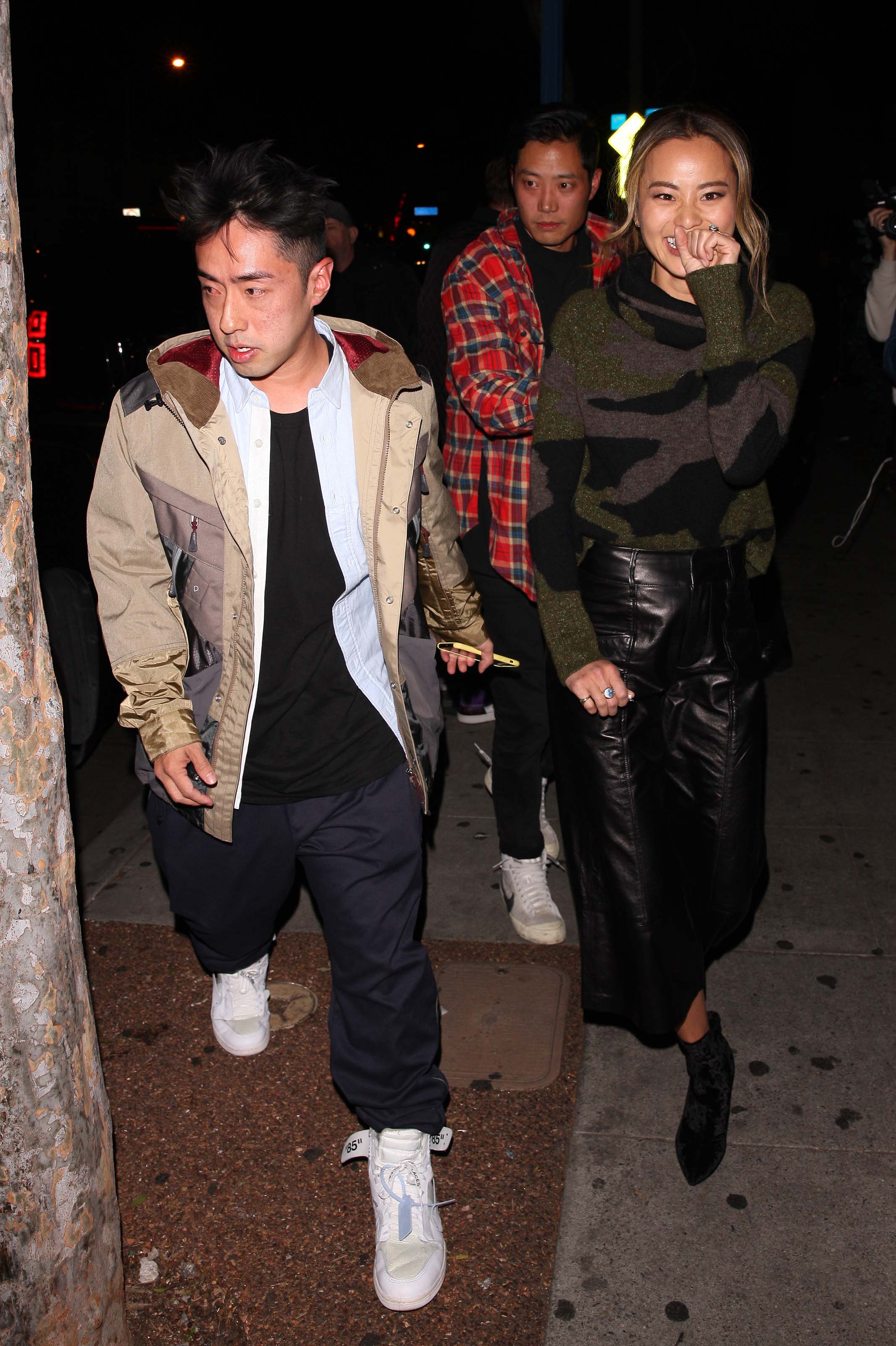 Jamie Chung leaves the Delilah club with a male friend