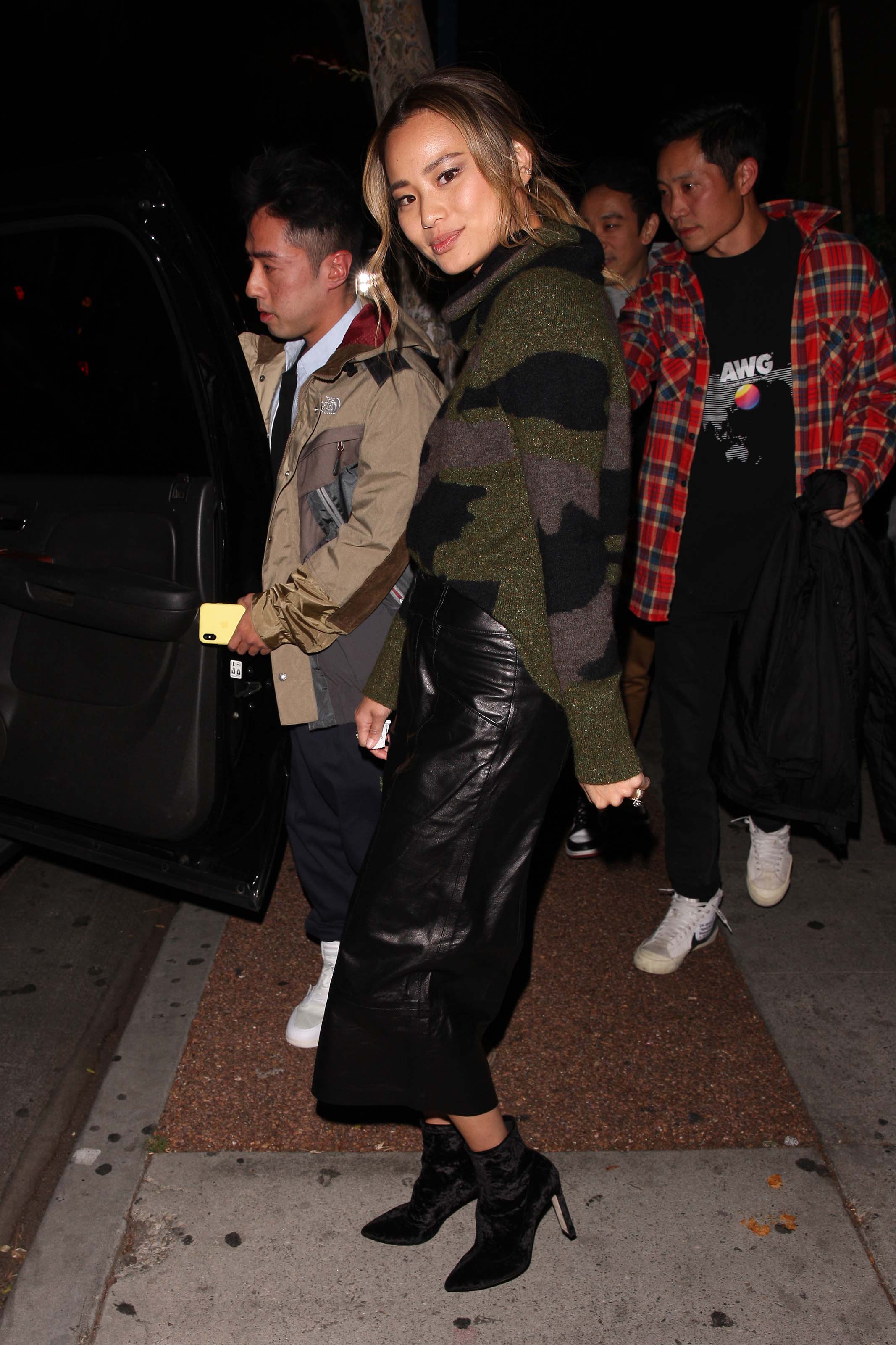 Jamie Chung leaves the Delilah club with a male friend