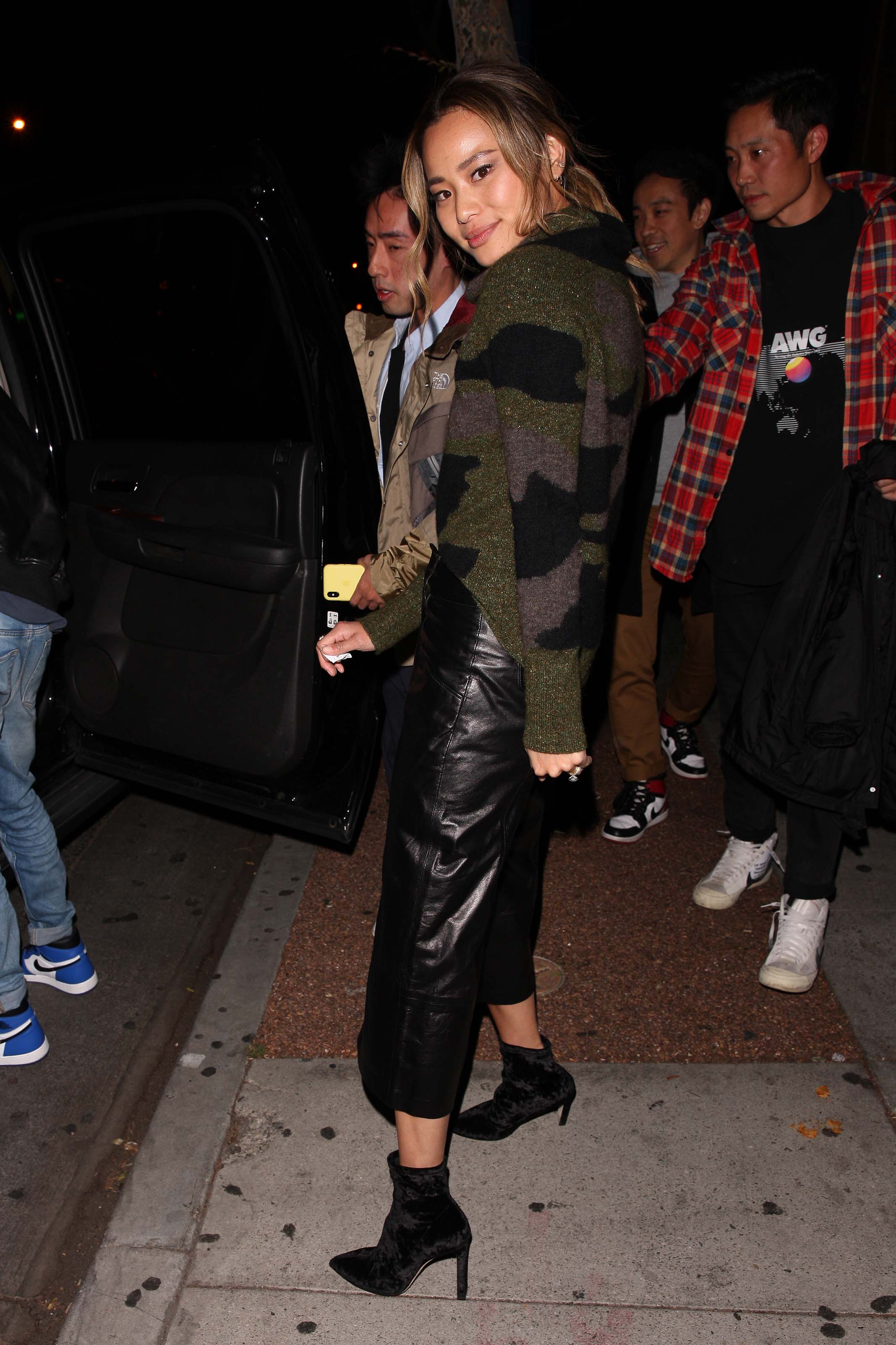 Jamie Chung leaves the Delilah club with a male friend