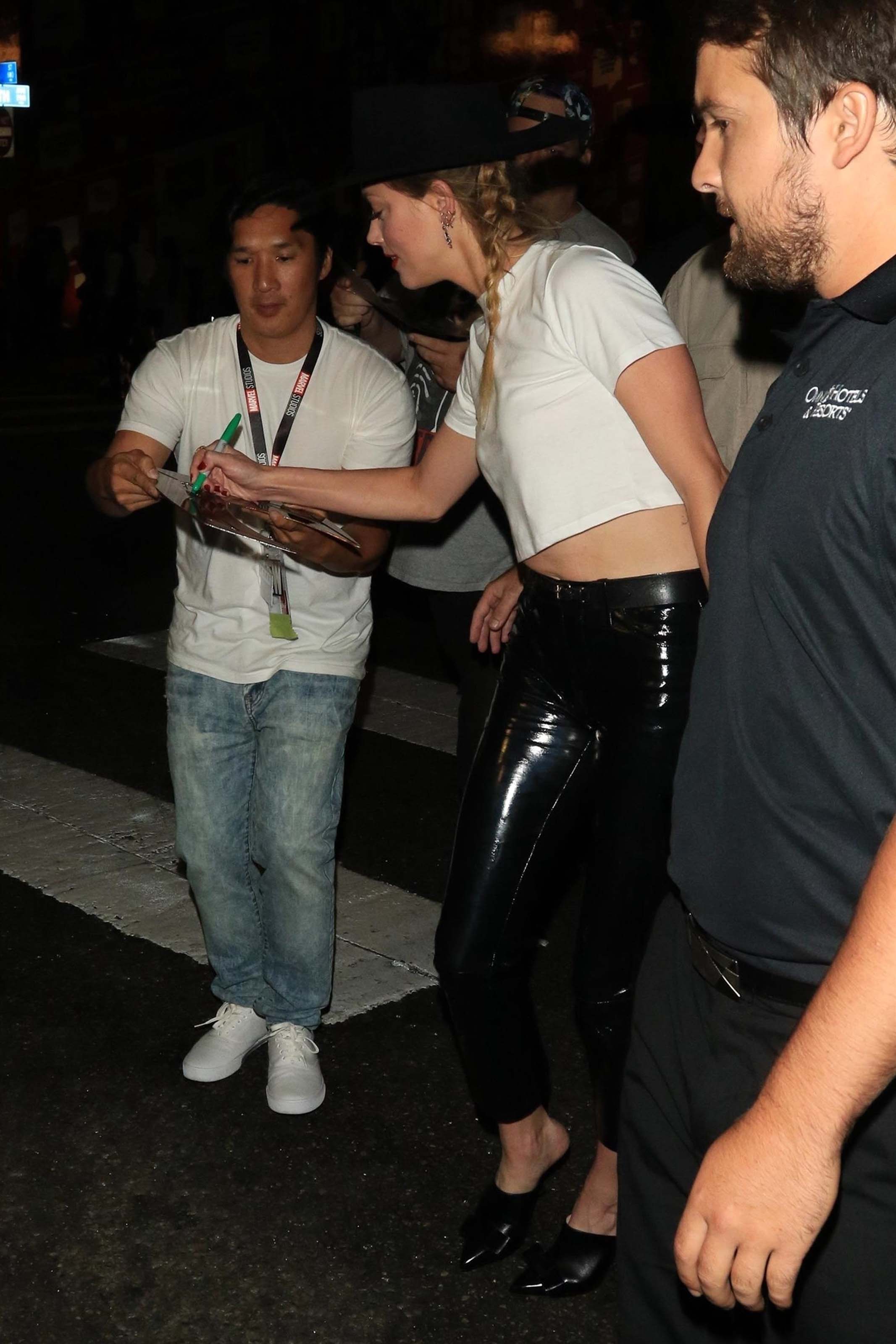 Amber Heard greets her adoring fans outside of the Hard Rock Hotel
