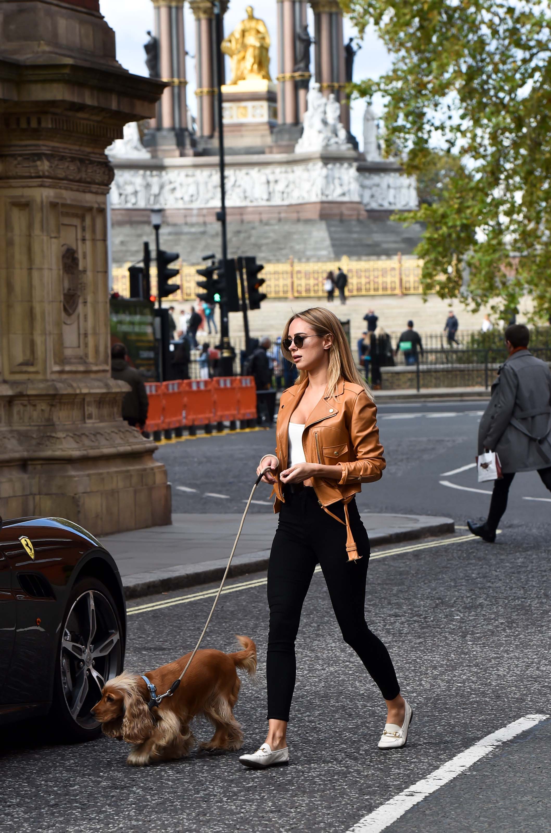 Kimberley Garner driving her Ferrari