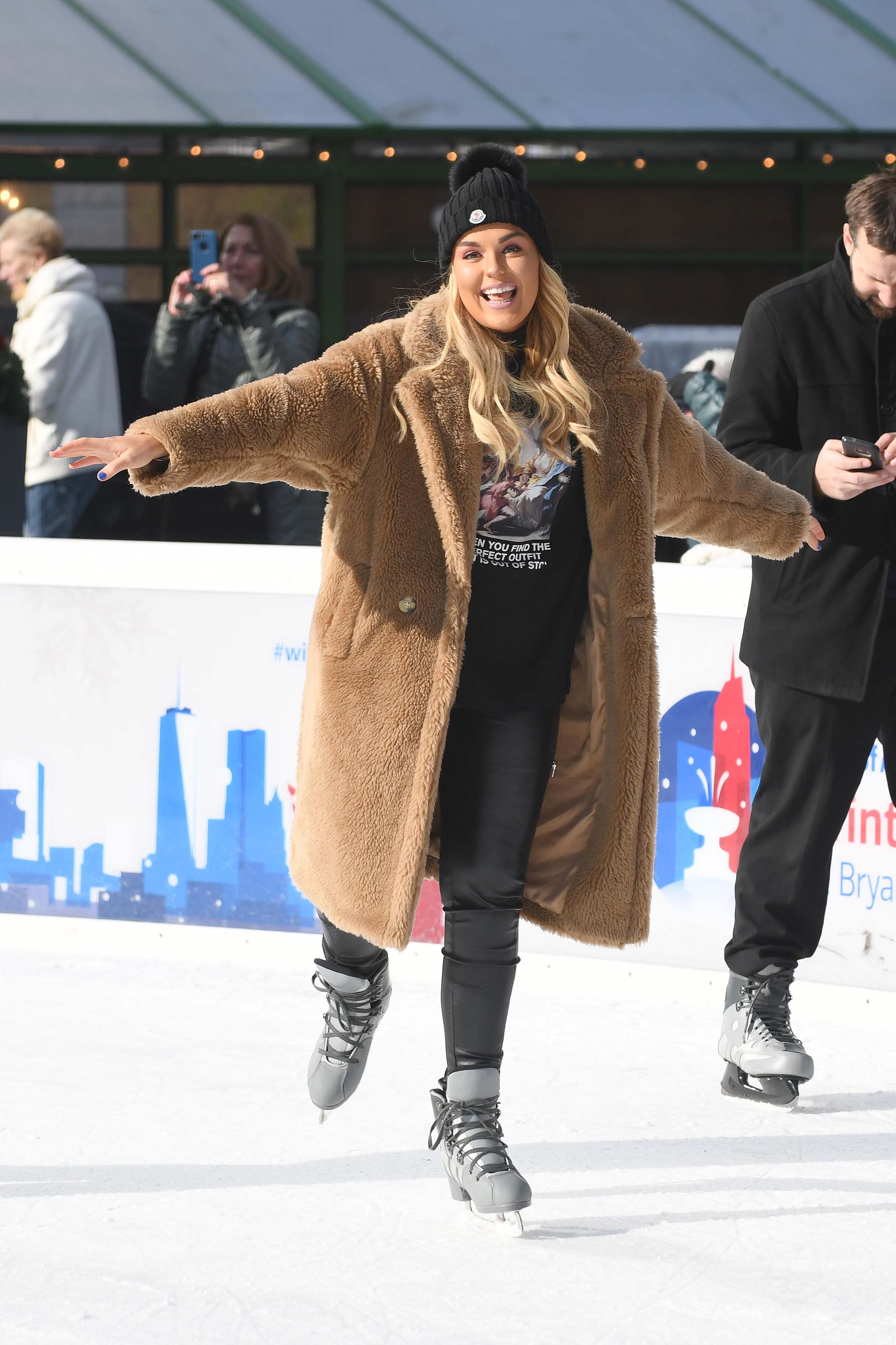 Tallia Storm ice skating in Bryant Park